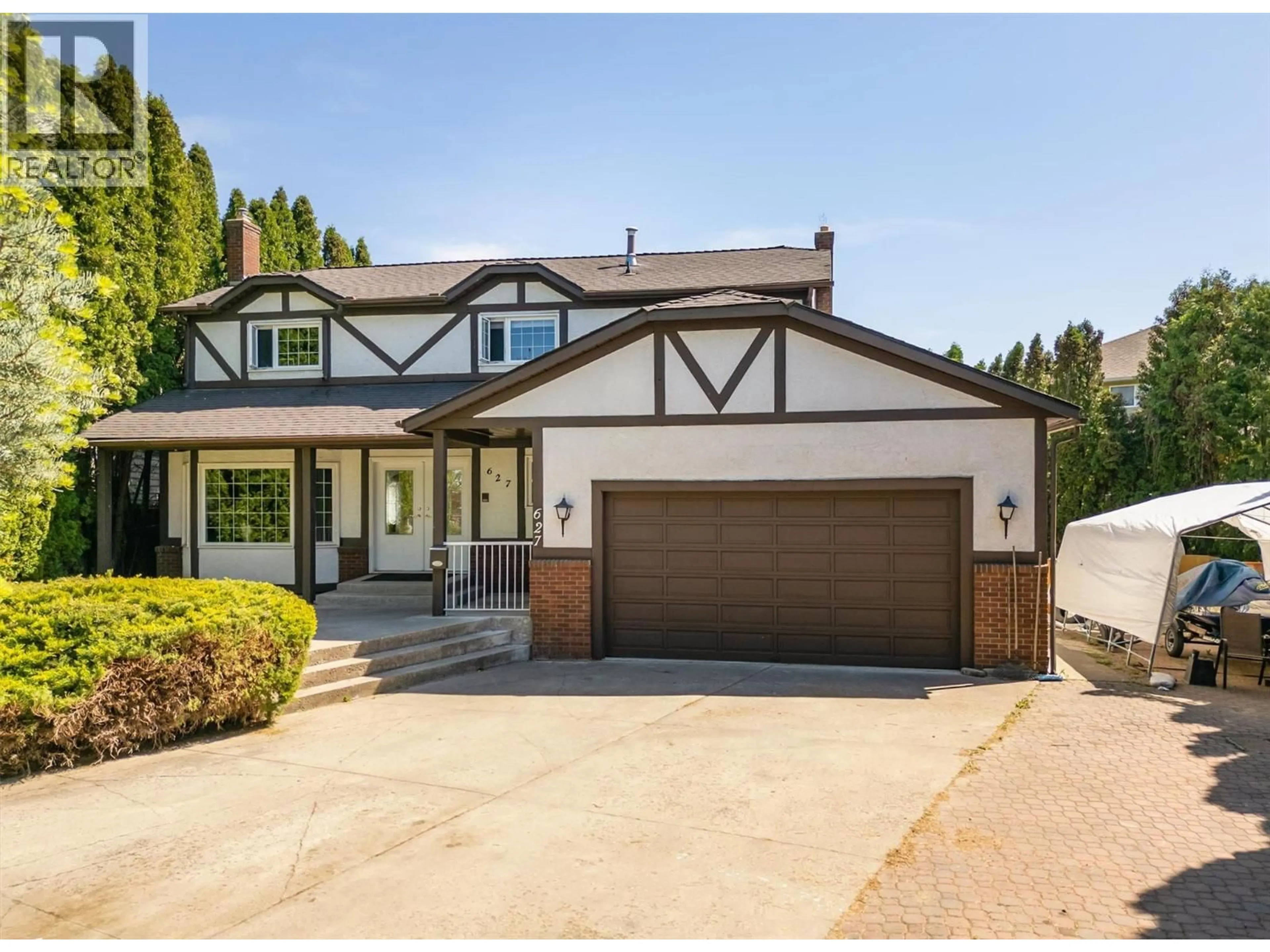 Home with vinyl exterior material, street for 627 HARDIE ROAD, Kelowna British Columbia V1X6W9