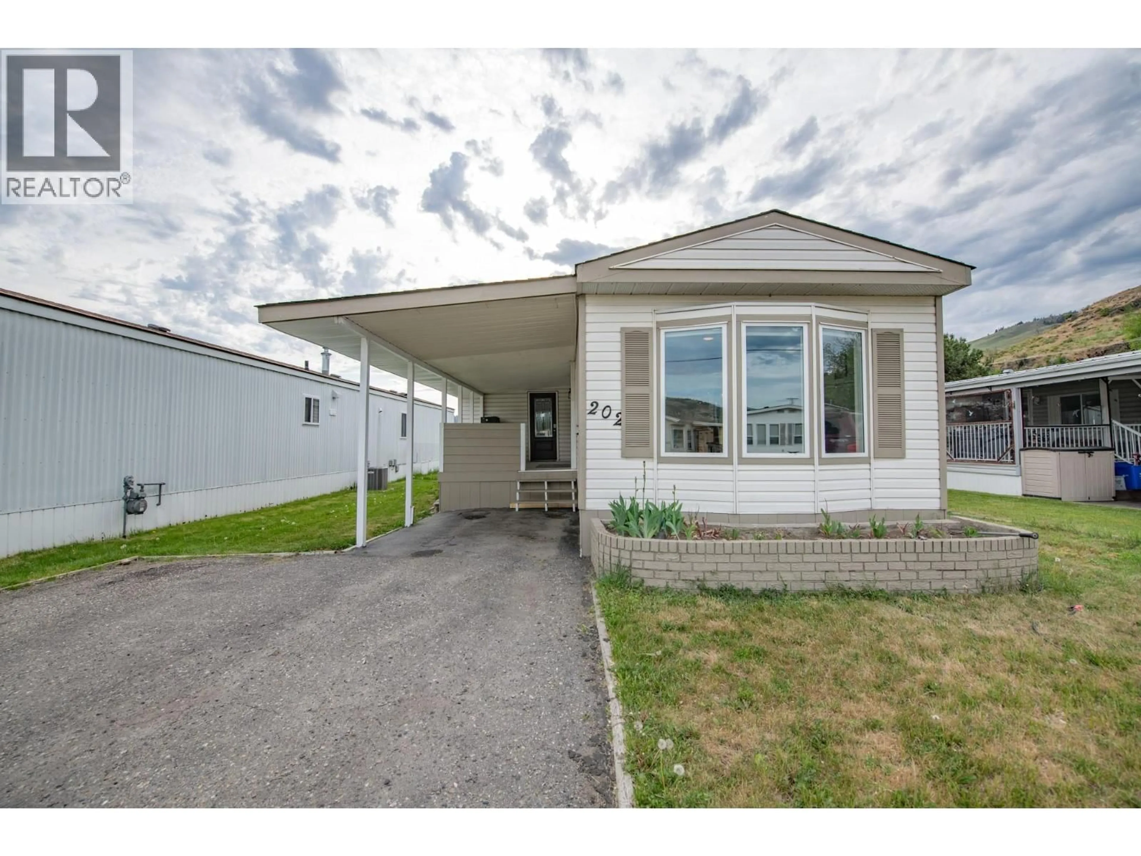 Home with vinyl exterior material, street for 6710 TRONSON ROAD, Vernon British Columbia V1H1X6