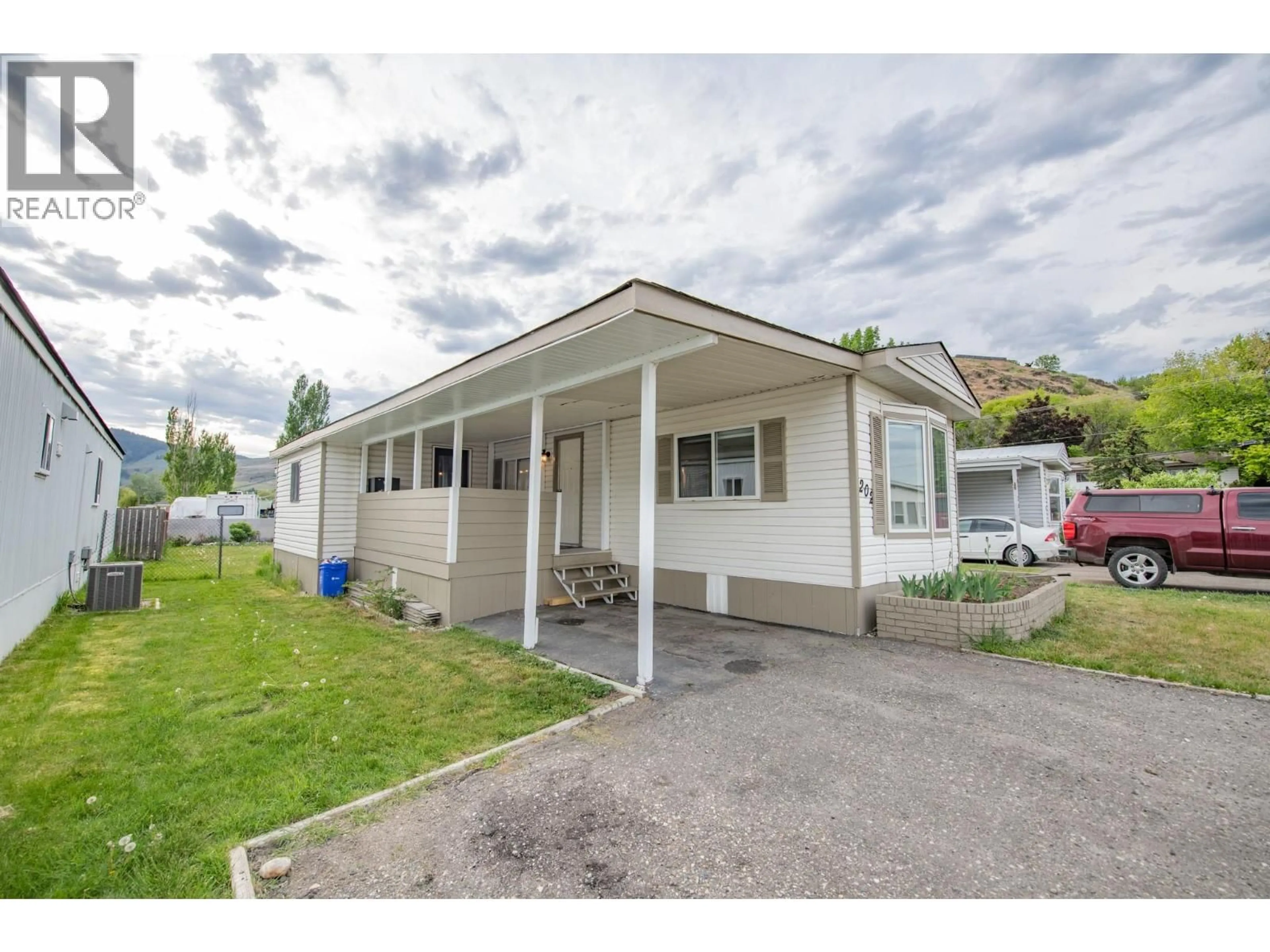 Home with vinyl exterior material, street for 6710 TRONSON ROAD, Vernon British Columbia V1H1X6