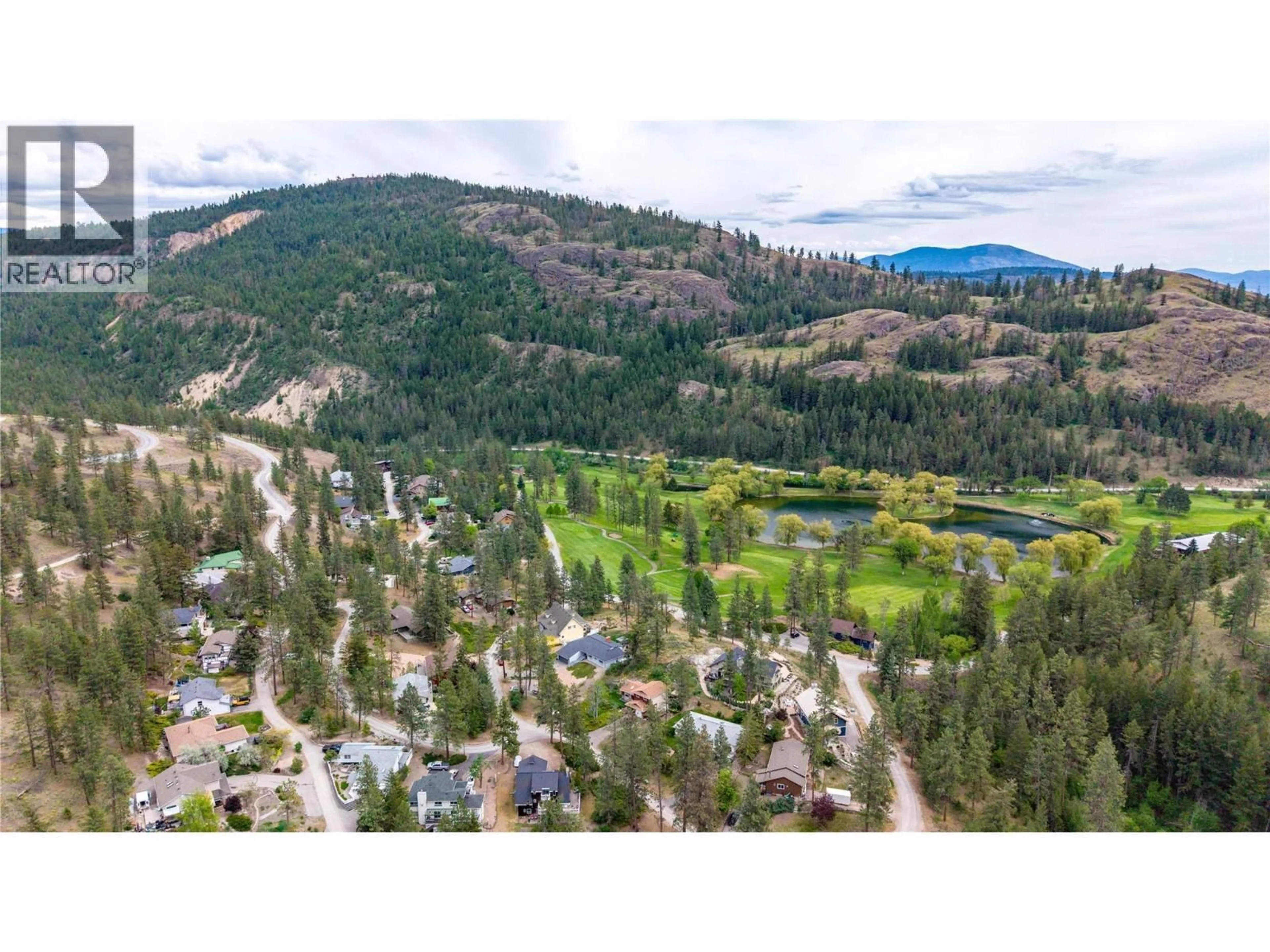 A pic from outside/outdoor area/front of a property/back of a property/a pic from drone, mountain view for 103 EAGLE DRIVE, Kaleden British Columbia V0H1K0