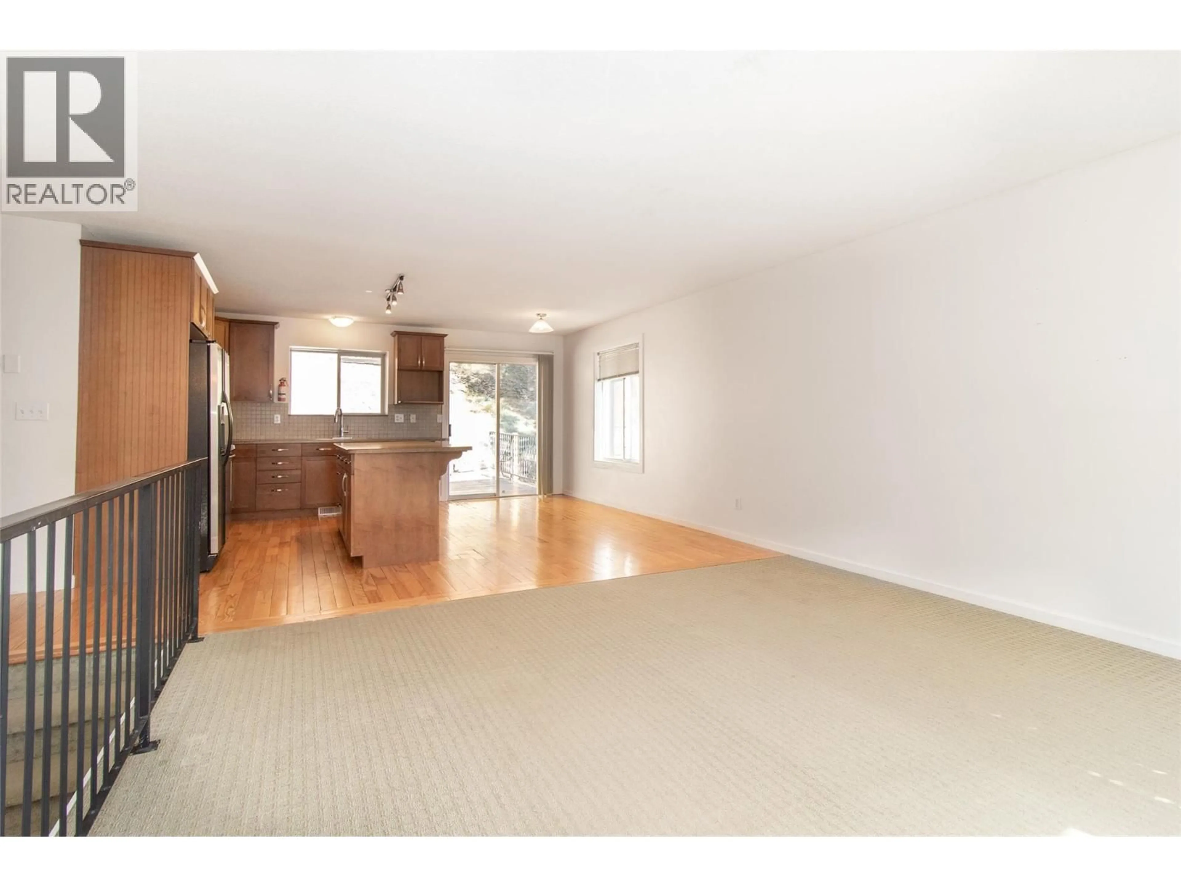 Open concept kitchen, wood/laminate floor for 477 CLIFTON ROAD, Kelowna British Columbia V1V1A6