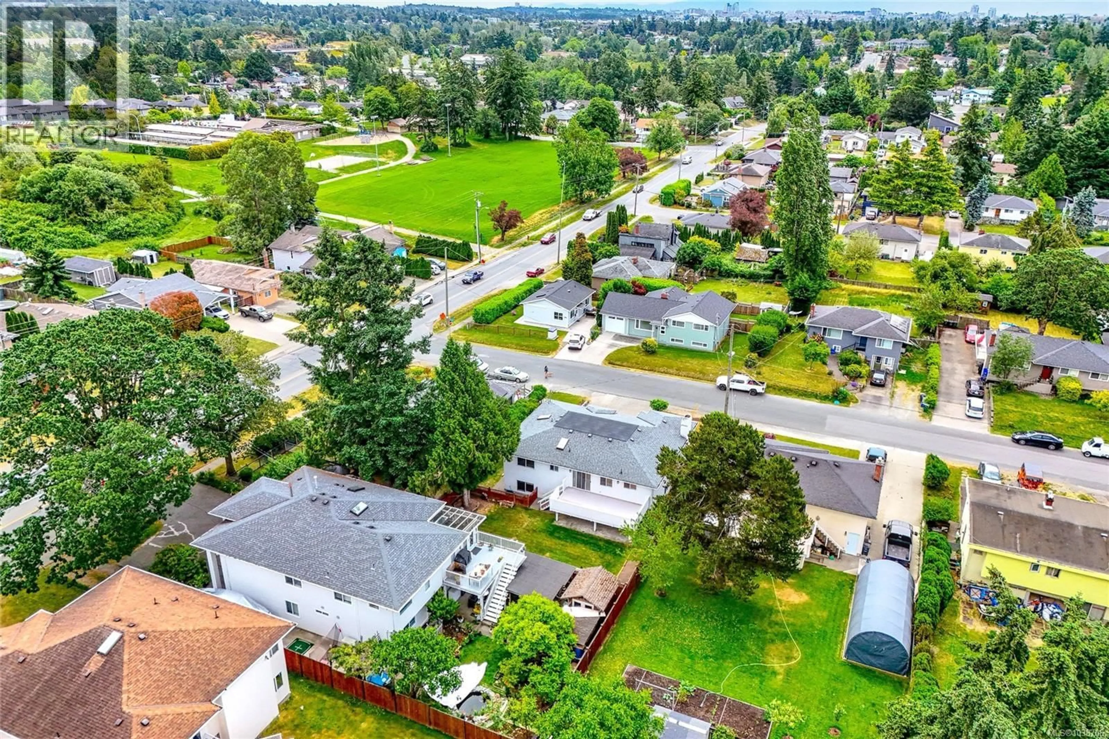 A pic from outside/outdoor area/front of a property/back of a property/a pic from drone, street for 598 TAIT STREET, Saanich British Columbia V8Z2C9