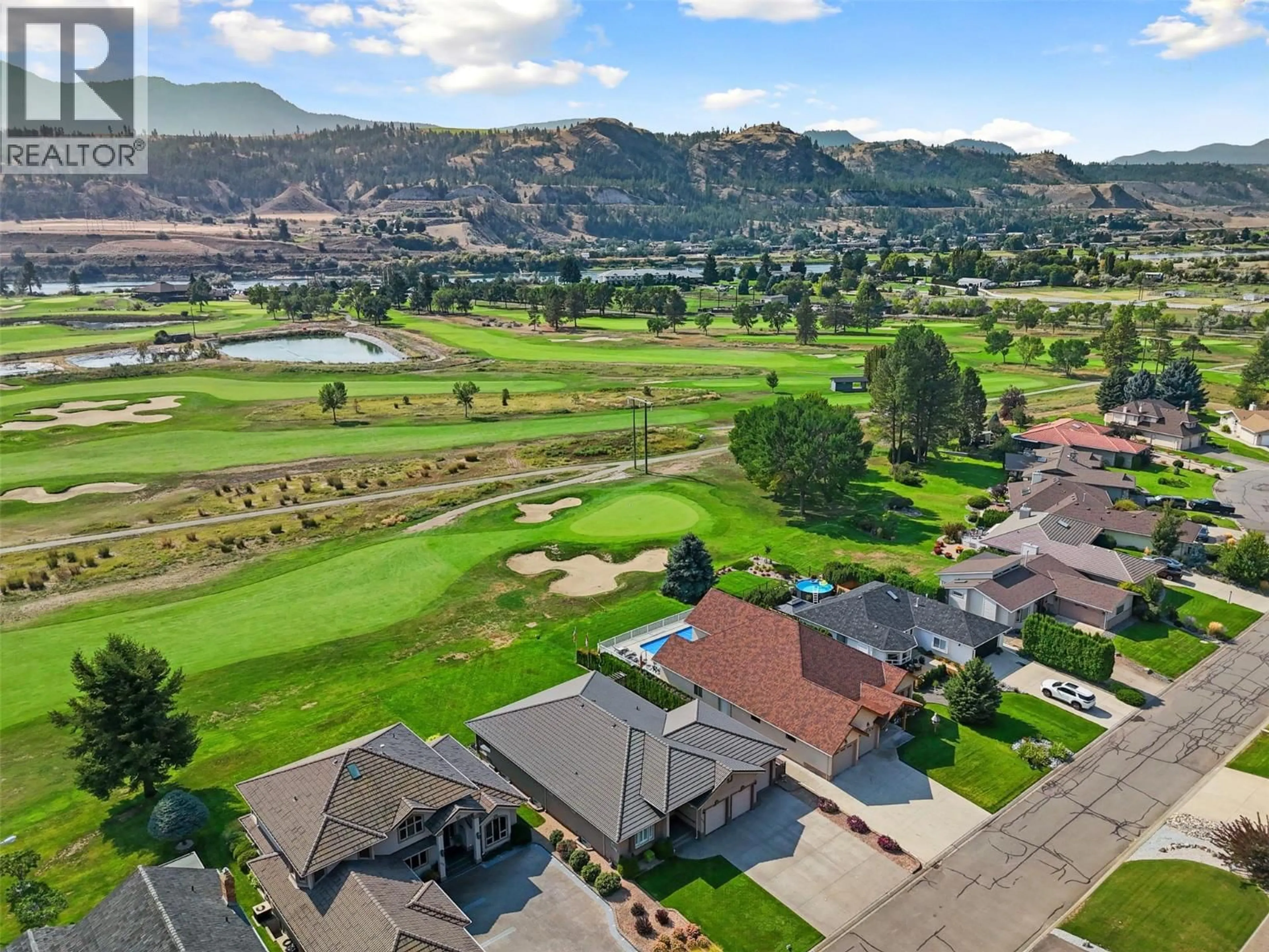 A pic from outside/outdoor area/front of a property/back of a property/a pic from drone, mountain view for 413 NUEVA WYND, Kamloops British Columbia V2H1S1