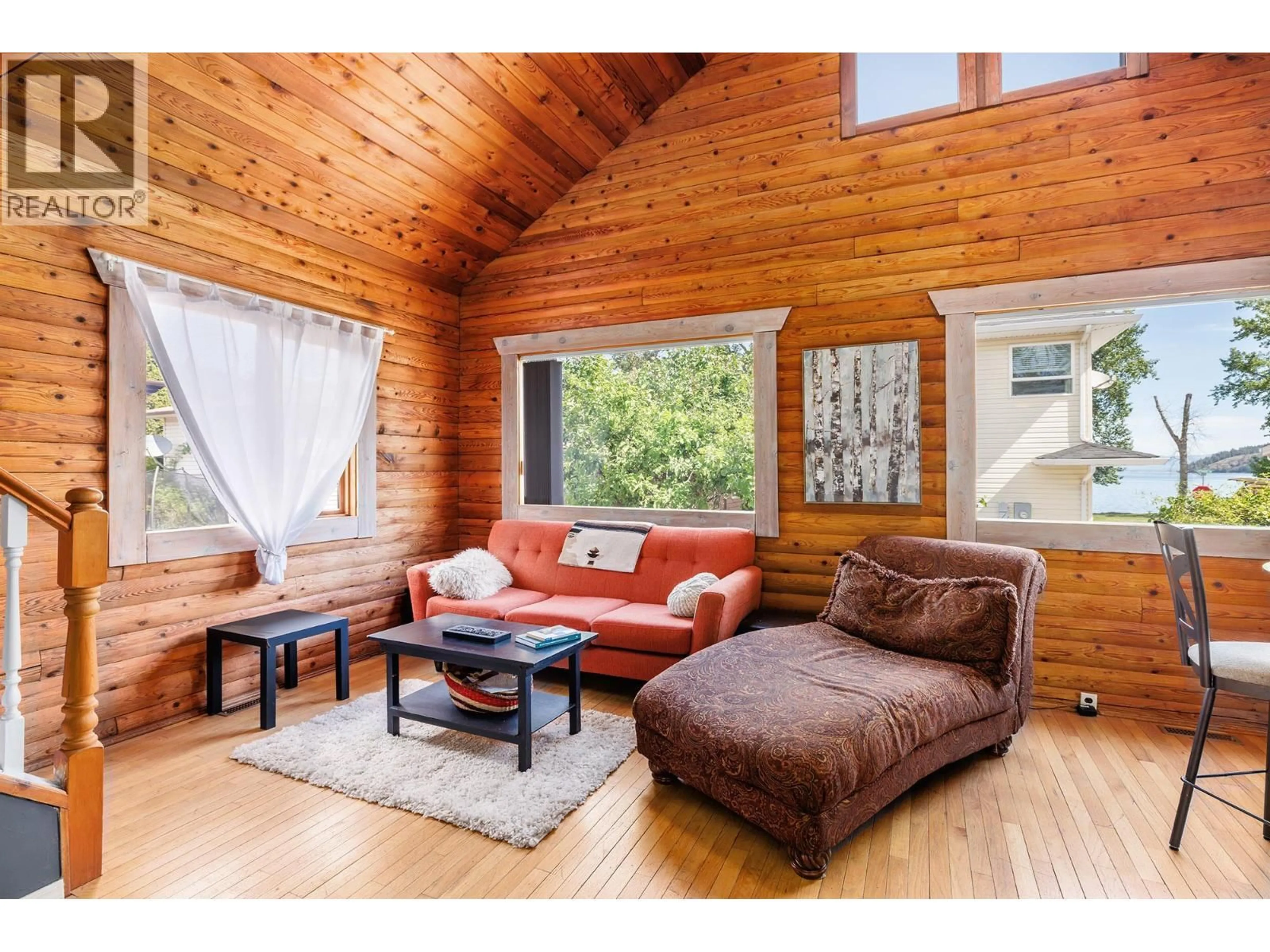 Living room with furniture, wood/laminate floor for 73 ELK STREET, Vernon British Columbia V1H2A1