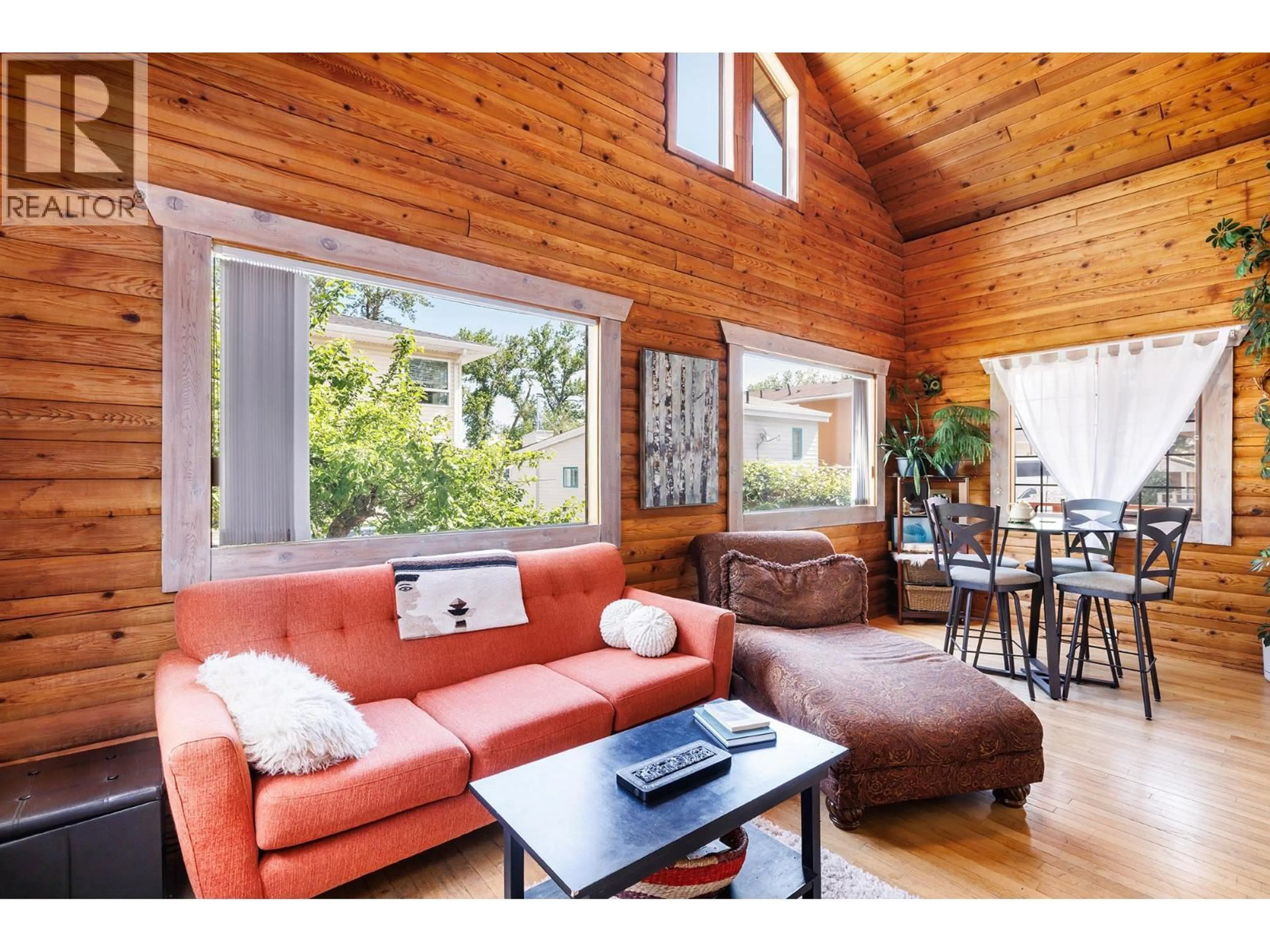 Living room with furniture, wood/laminate floor for 73 ELK STREET, Vernon British Columbia V1H2A1