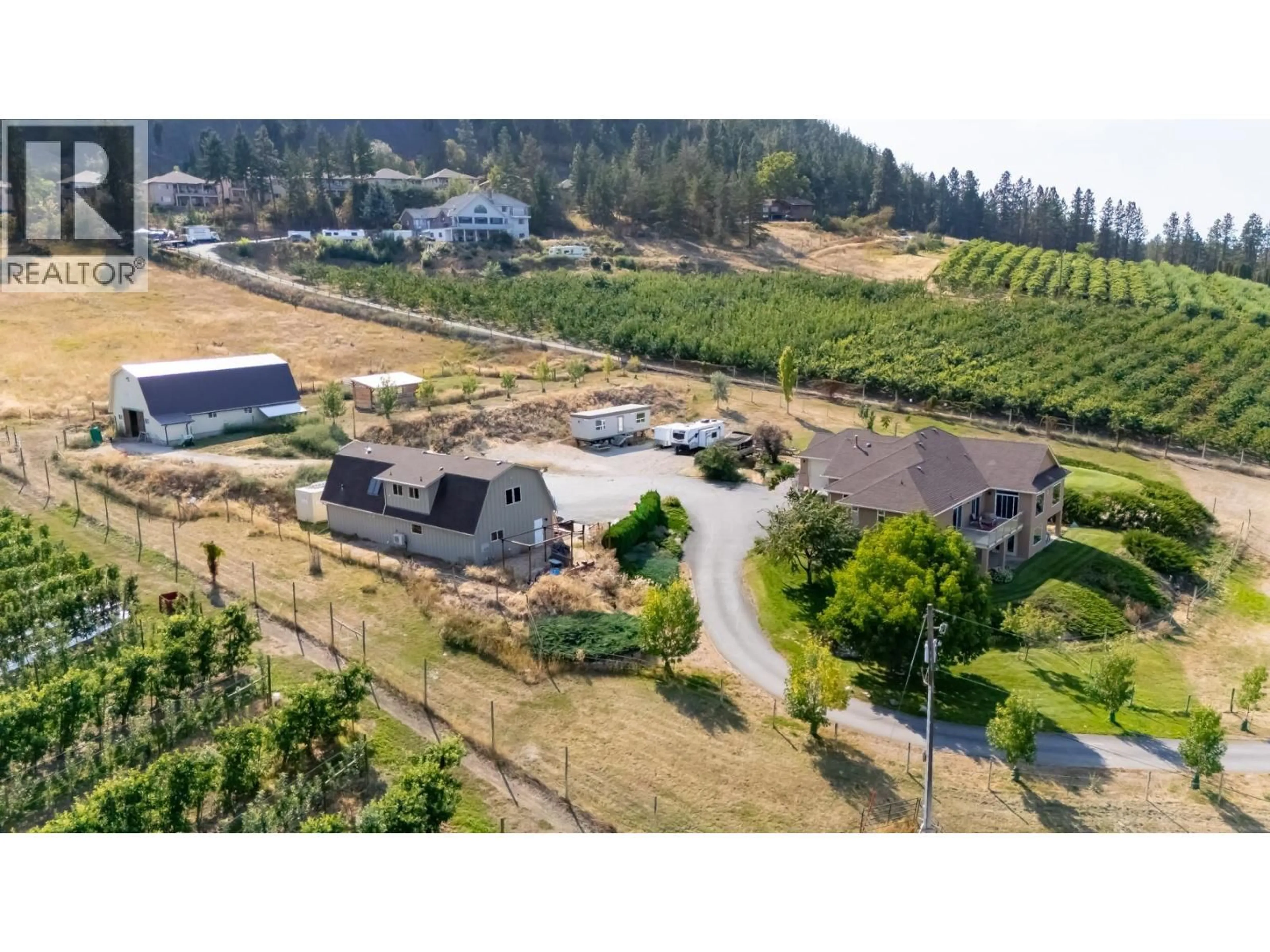 A pic from outside/outdoor area/front of a property/back of a property/a pic from drone, mountain view for 2241 ROJEM ROAD, Kelowna British Columbia V1V2G3