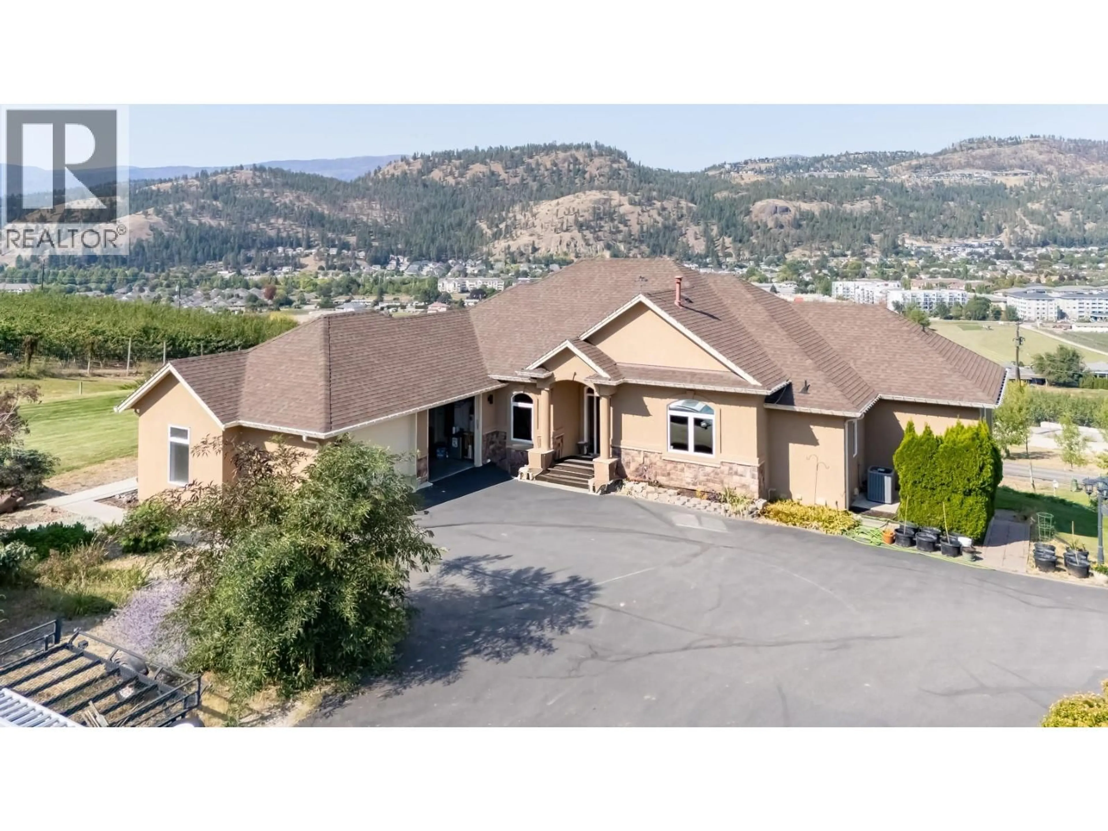 A pic from outside/outdoor area/front of a property/back of a property/a pic from drone, mountain view for 2241 ROJEM ROAD, Kelowna British Columbia V1V2G3