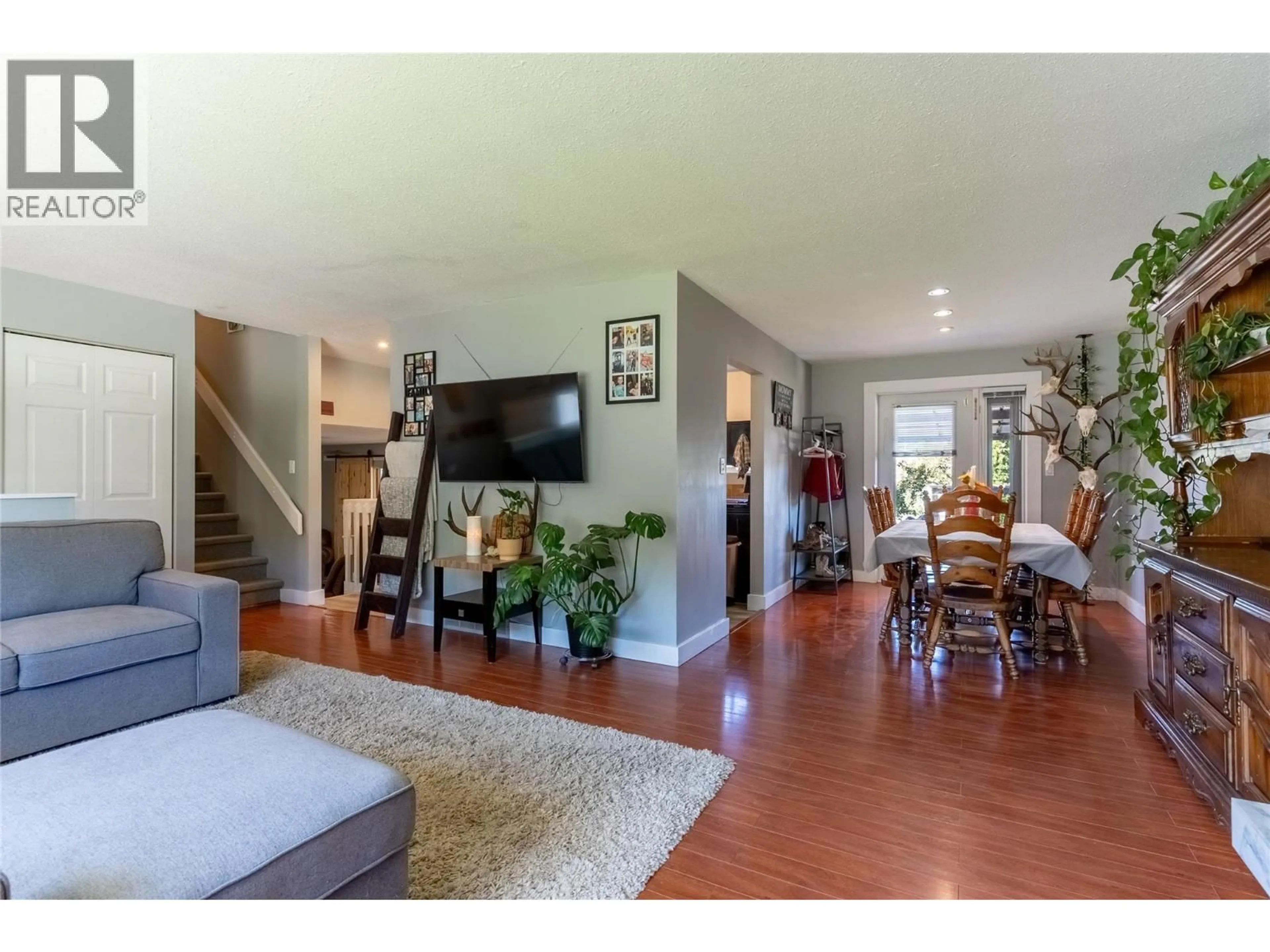 Living room with furniture, wood/laminate floor for 8 BRECCIA DRIVE, Logan Lake British Columbia V0K1W0