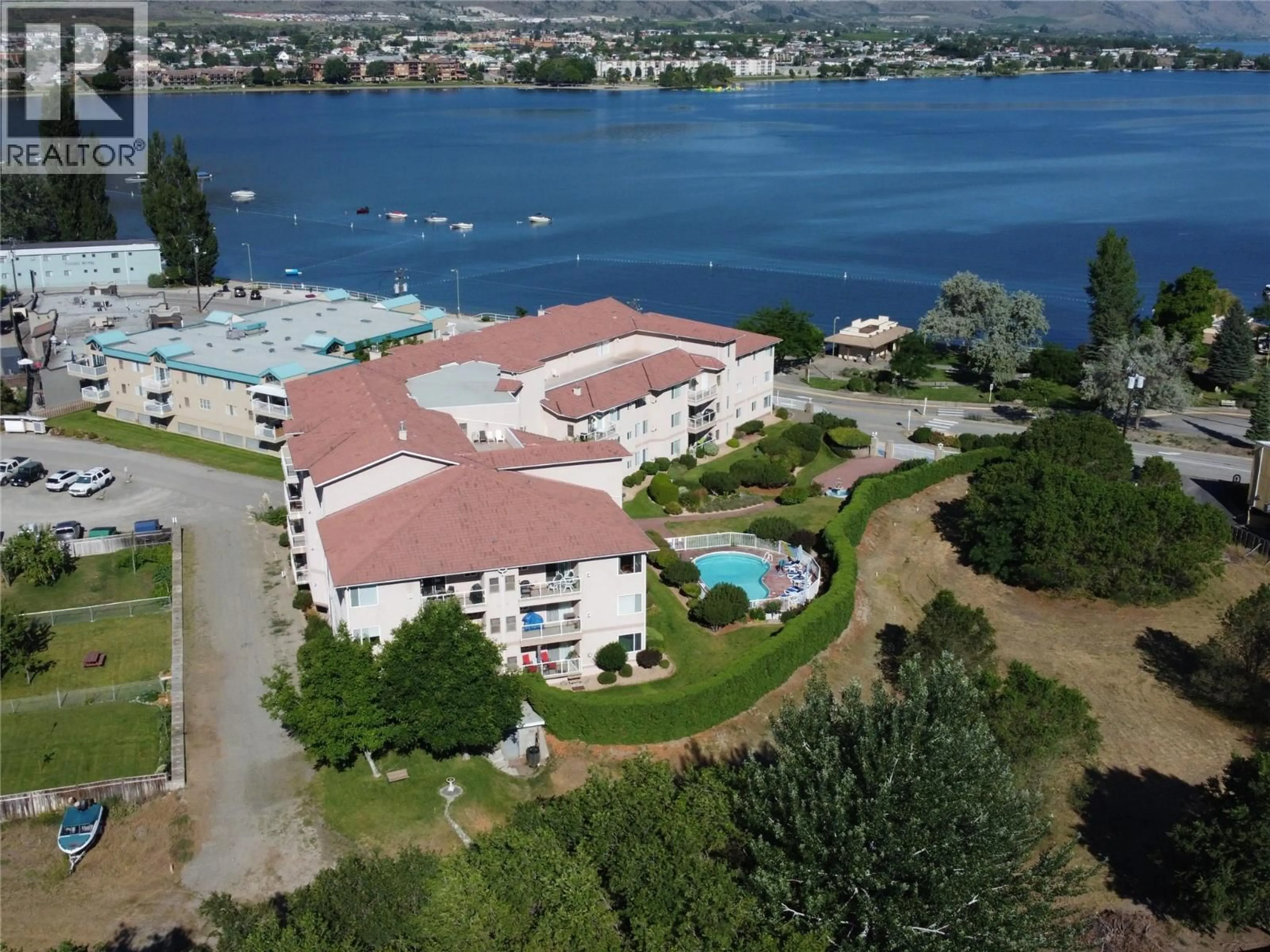 A pic from outside/outdoor area/front of a property/back of a property/a pic from drone, water/lake/river/ocean view for 201 - 6805 COTTONWOOD DRIVE, Osoyoos British Columbia V0H1V3