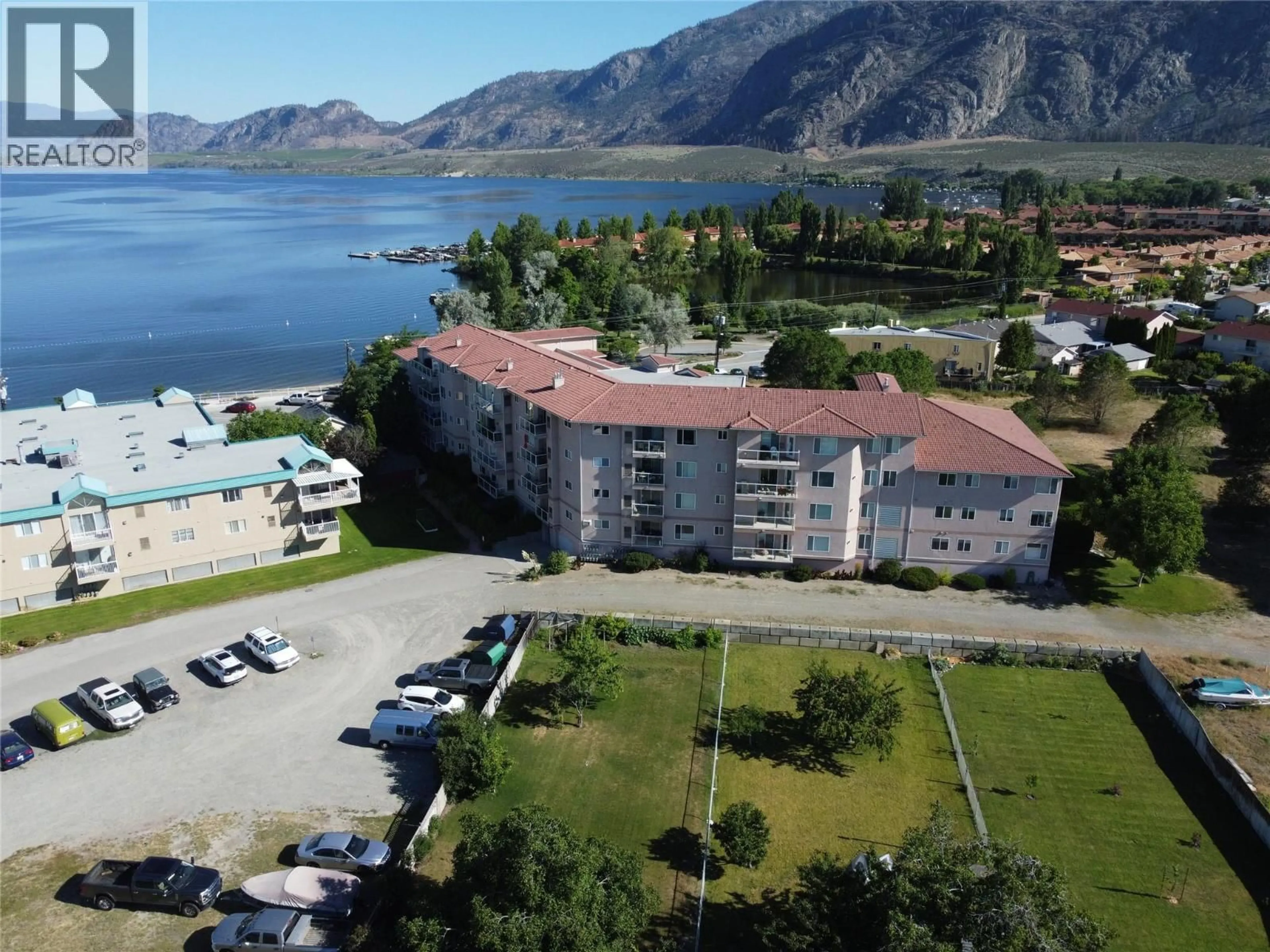A pic from outside/outdoor area/front of a property/back of a property/a pic from drone, mountain view for 201 - 6805 COTTONWOOD DRIVE, Osoyoos British Columbia V0H1V3
