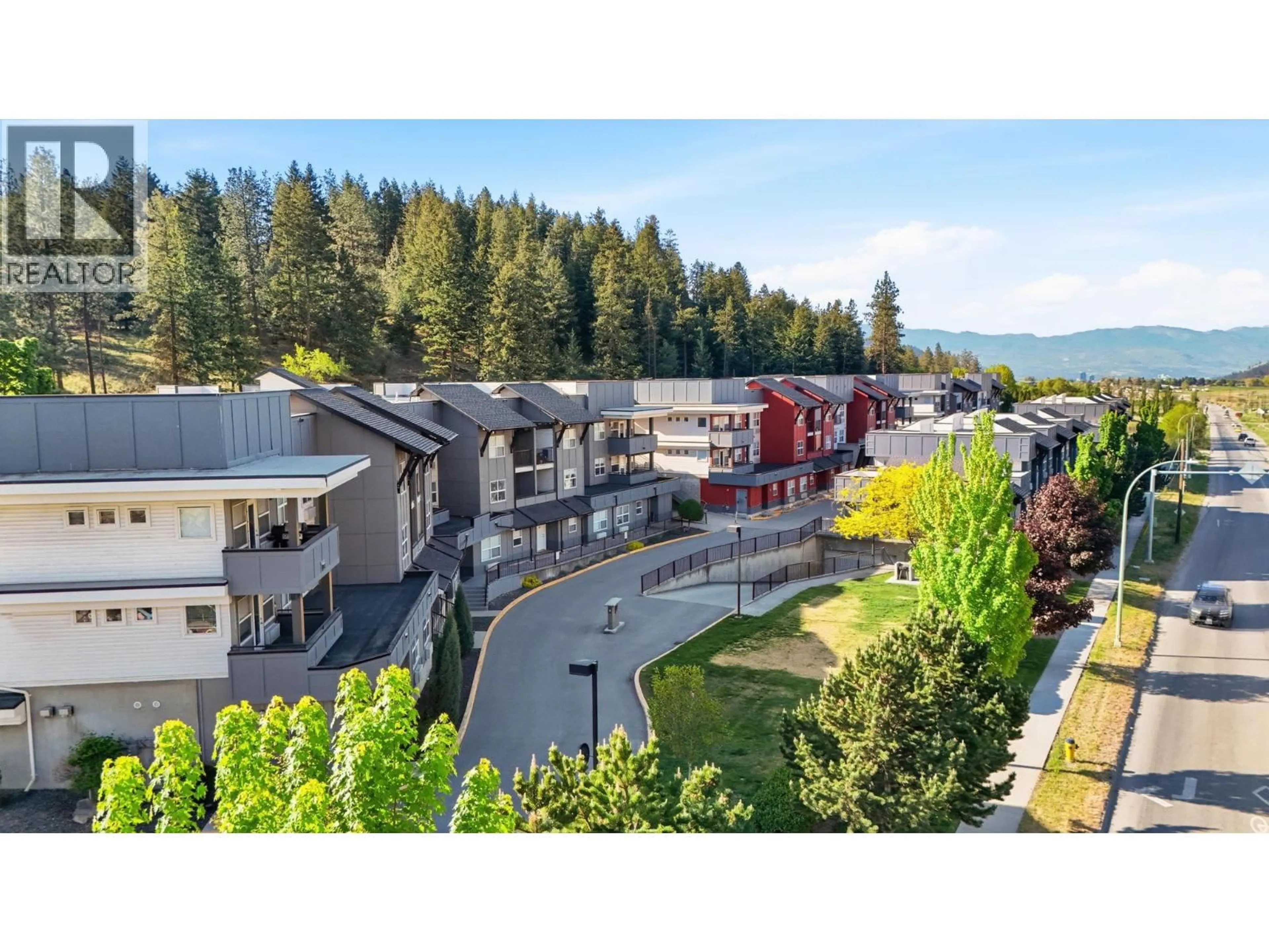 A pic from outside/outdoor area/front of a property/back of a property/a pic from drone, mountain view for 311 - 1483 GLENMORE ROAD, Kelowna British Columbia V1V2C5