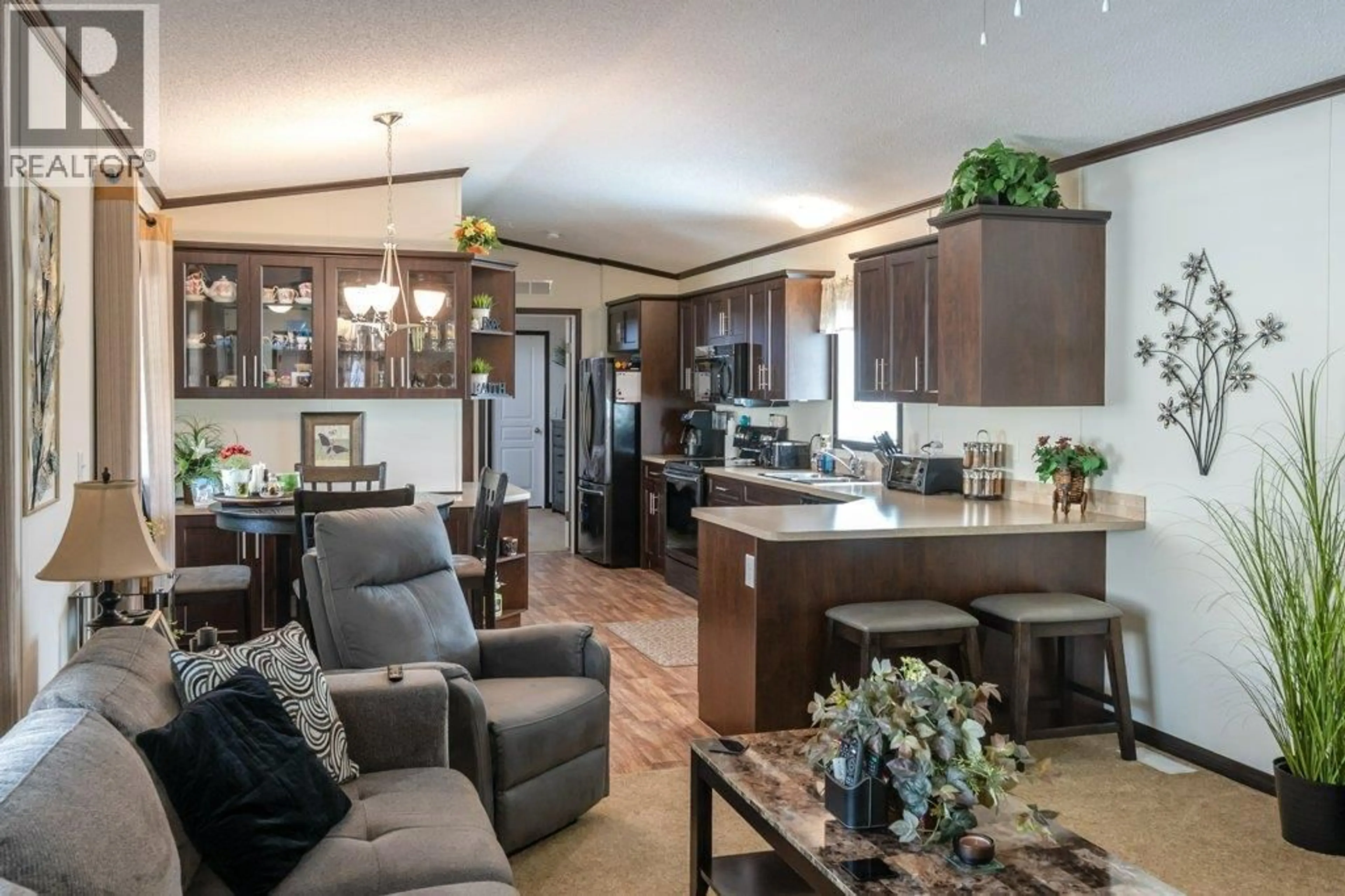 Open concept kitchen, wood/laminate floor for 36 - 6633 PARK DRIVE, Oliver British Columbia V0H1T4