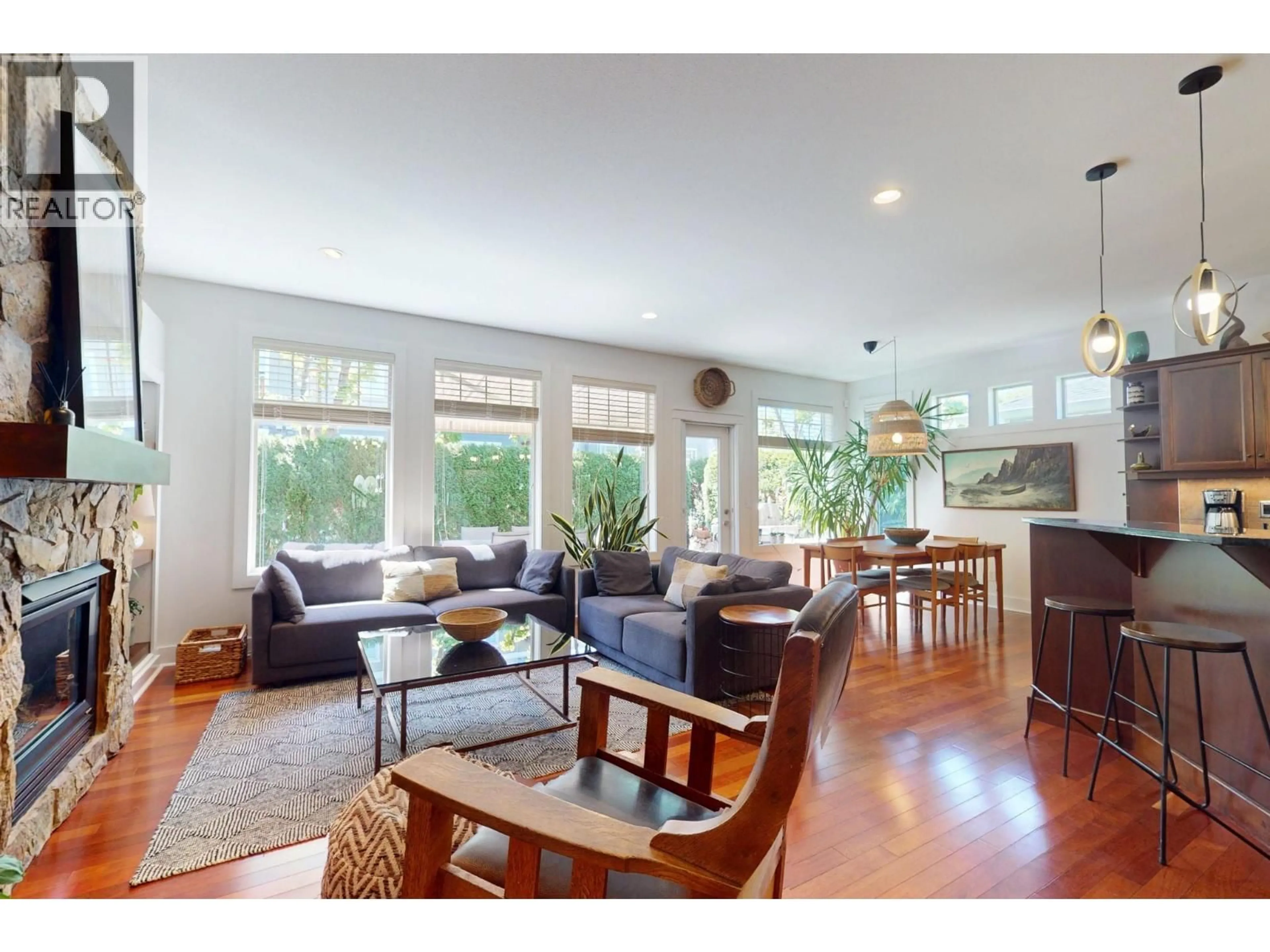 Living room with furniture, wood/laminate floor for 32 - 670 LEQUIME ROAD, Kelowna British Columbia V1W1A4