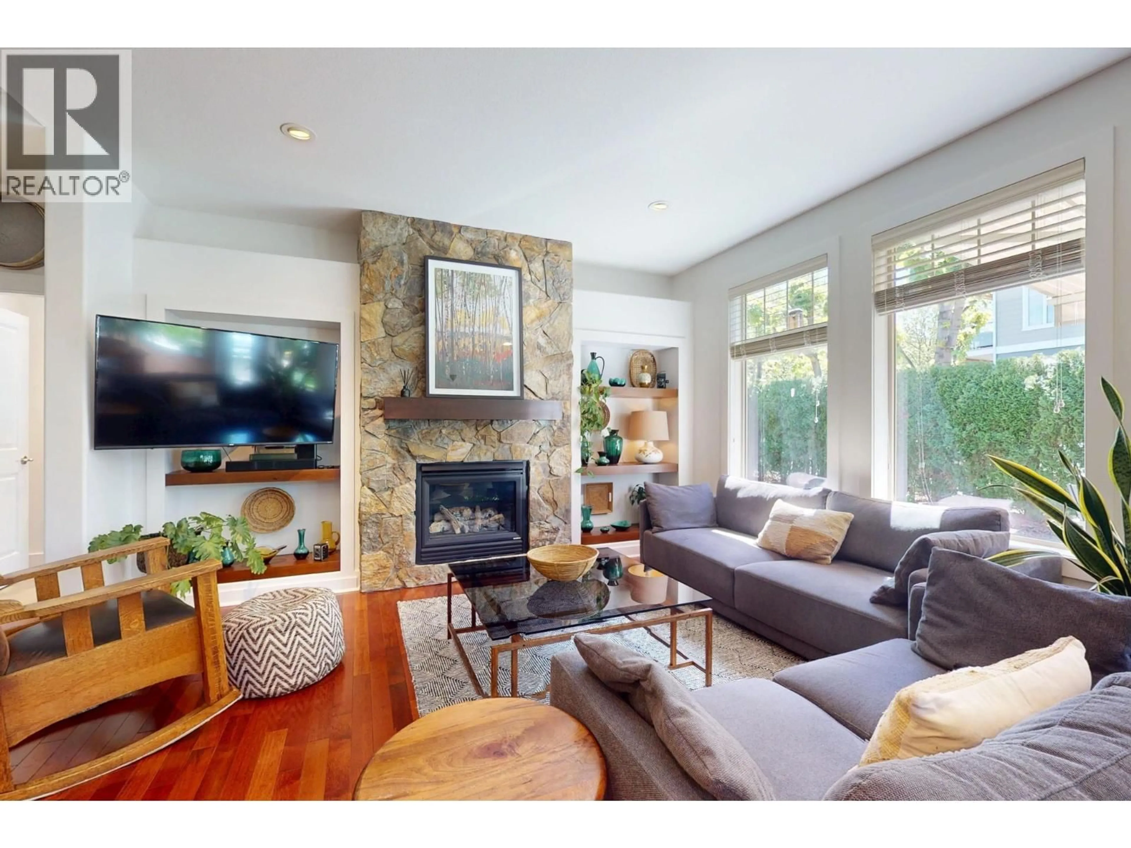Living room with furniture, wood/laminate floor for 32 - 670 LEQUIME ROAD, Kelowna British Columbia V1W1A4