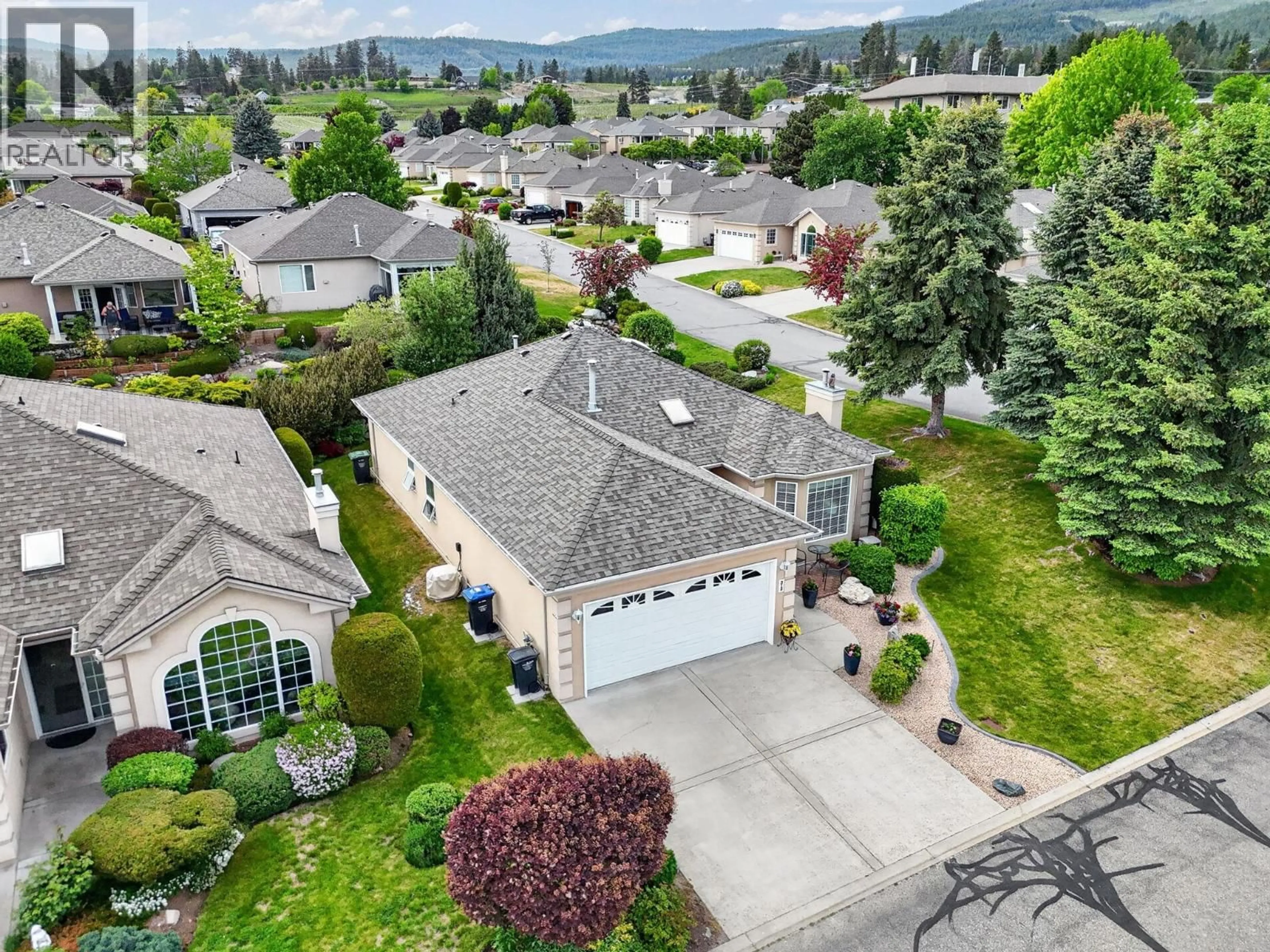 A pic from outside/outdoor area/front of a property/back of a property/a pic from drone, mountain view for 212 - 3360 OLD OKANAGAN HIGHWAY, West Kelowna British Columbia V4T1X9