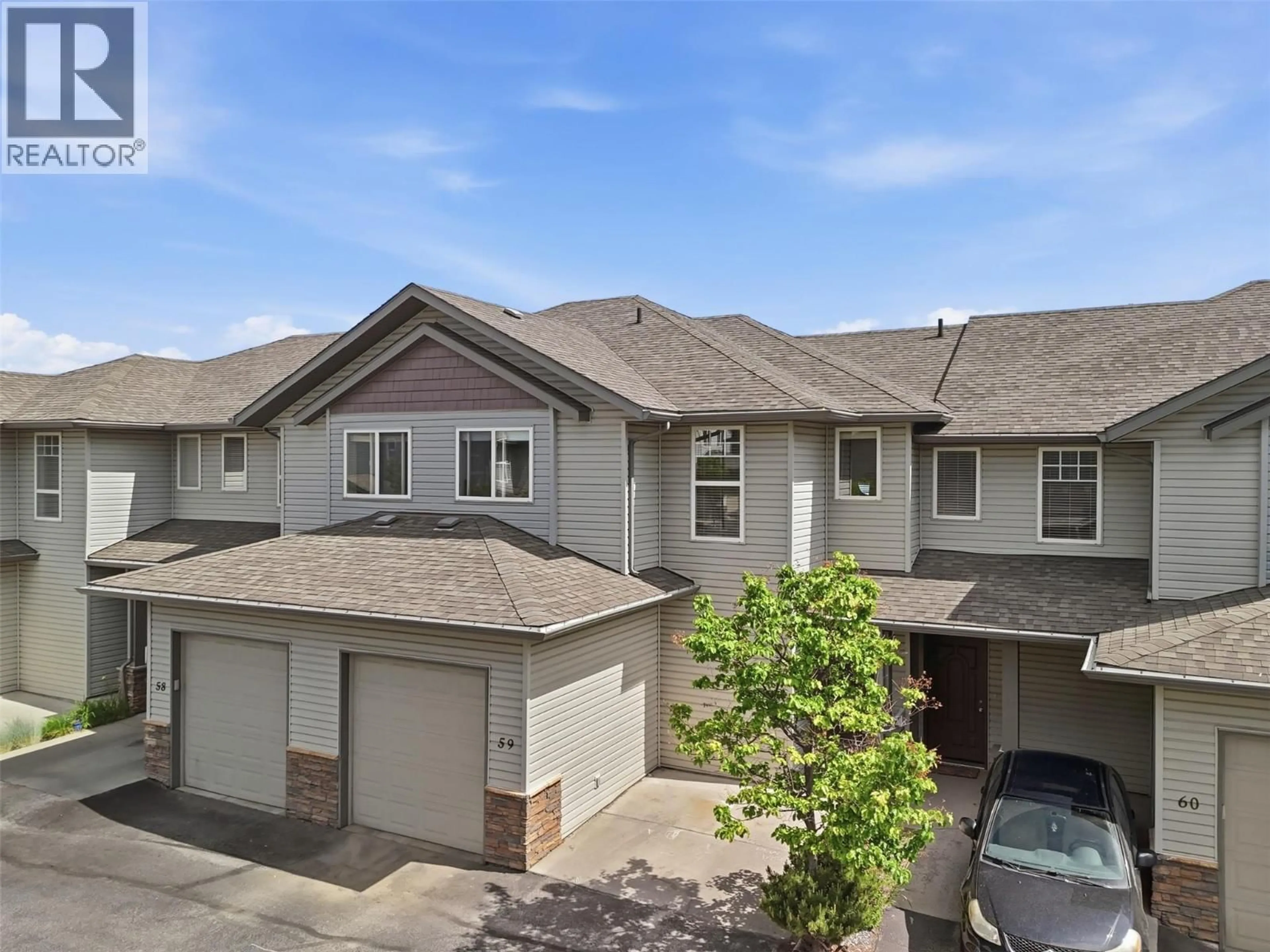 A pic from outside/outdoor area/front of a property/back of a property/a pic from drone, street for 59 - 2046 ROBSON PLACE, Kamloops British Columbia V2E0A5