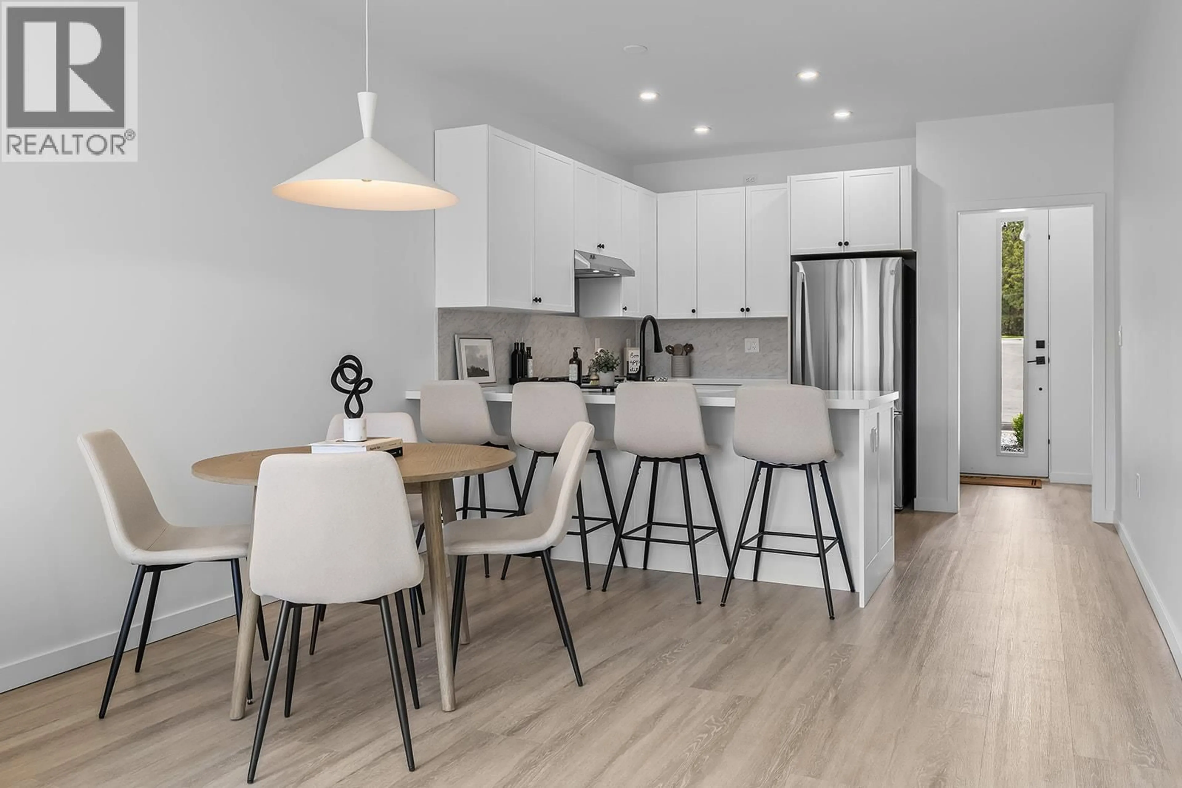 Open concept kitchen, wood/laminate floor for 10 - 3210 SALMON ROAD, West Kelowna British Columbia V4T1A7