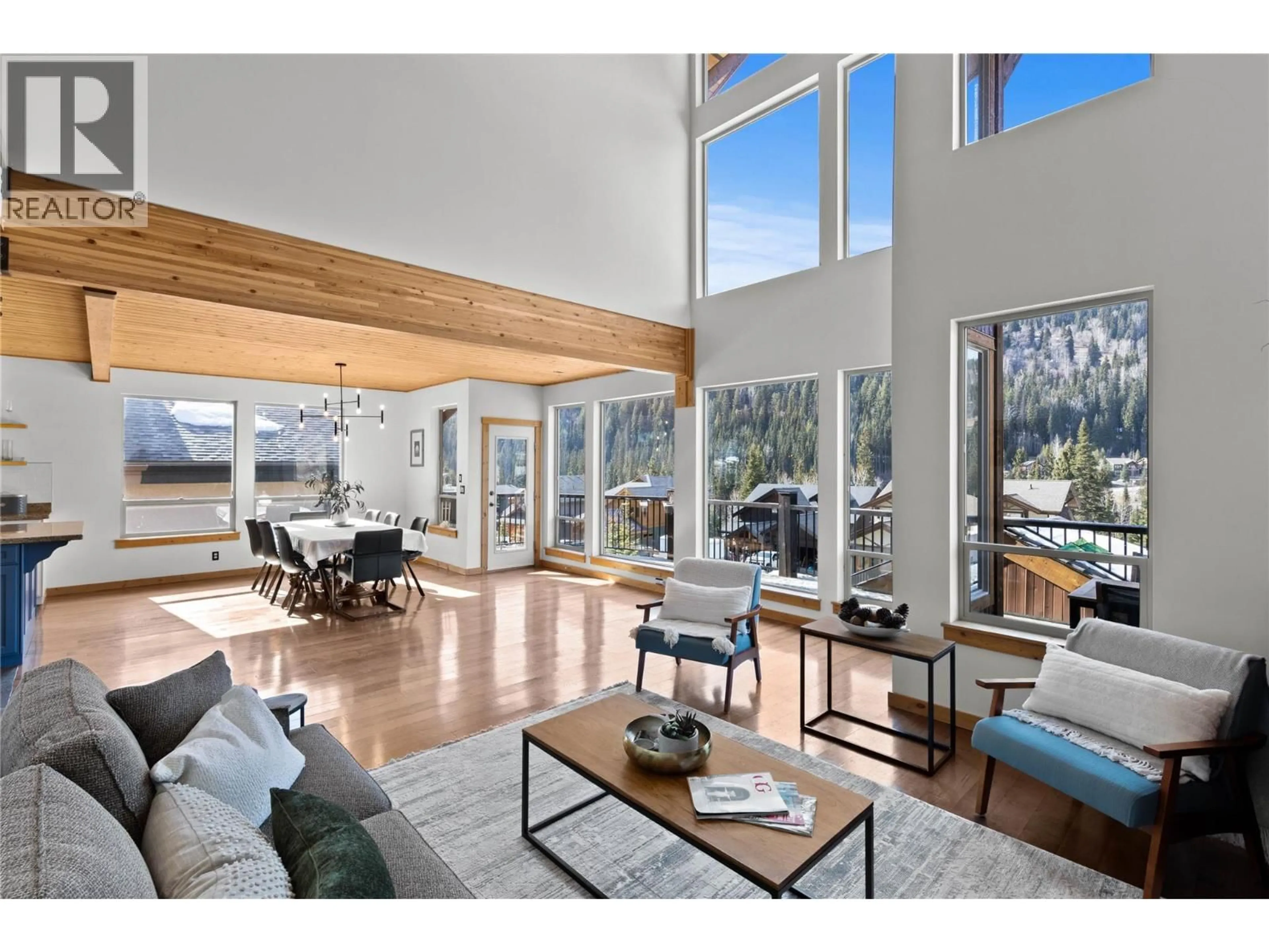 Living room with furniture, wood/laminate floor for 2431 FAIRWAYS DRIVE, Sun Peaks British Columbia V0E5N0