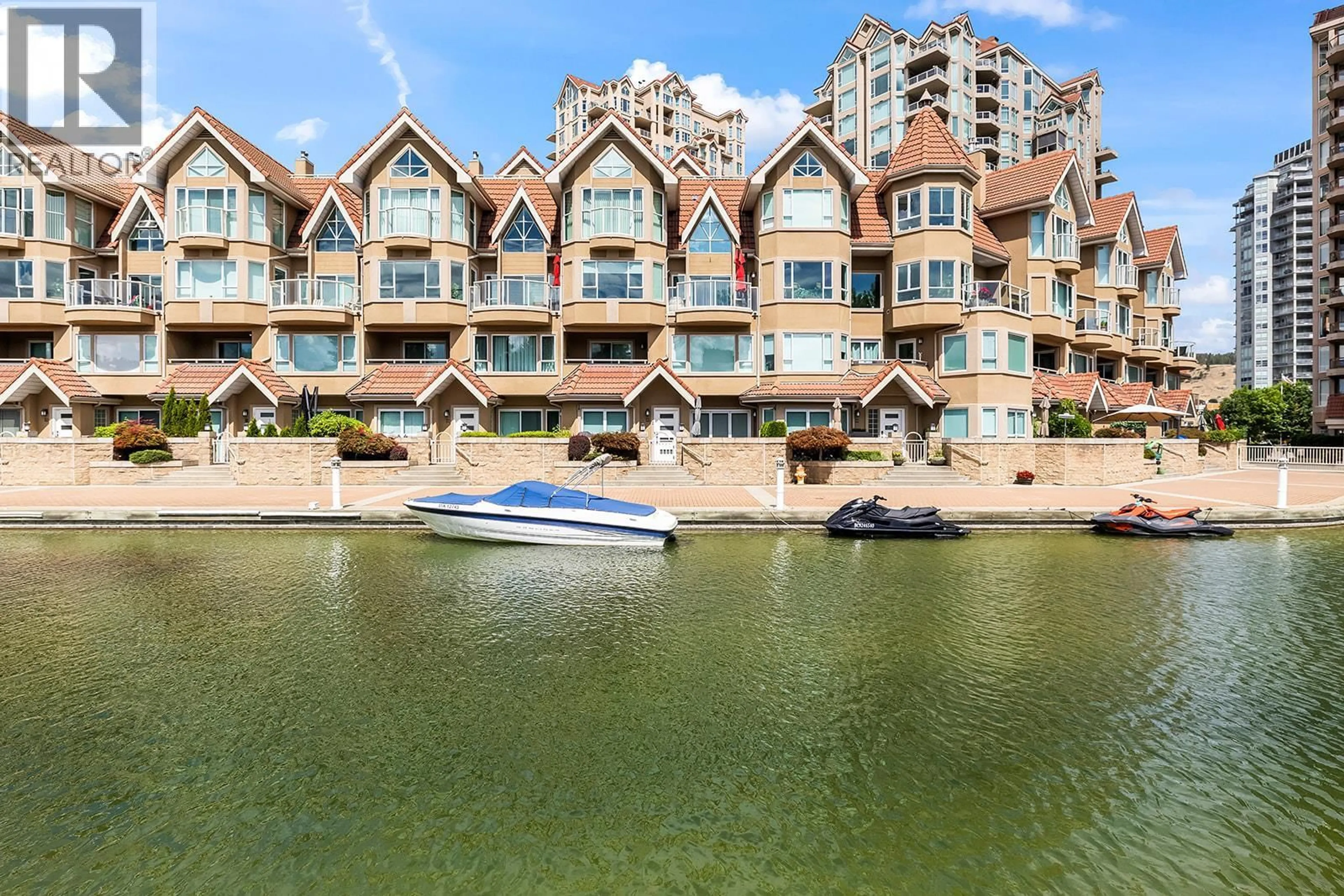A pic from outside/outdoor area/front of a property/back of a property/a pic from drone, water/lake/river/ocean view for 123 - 1156 SUNSET DRIVE, Kelowna British Columbia V1Y9R7