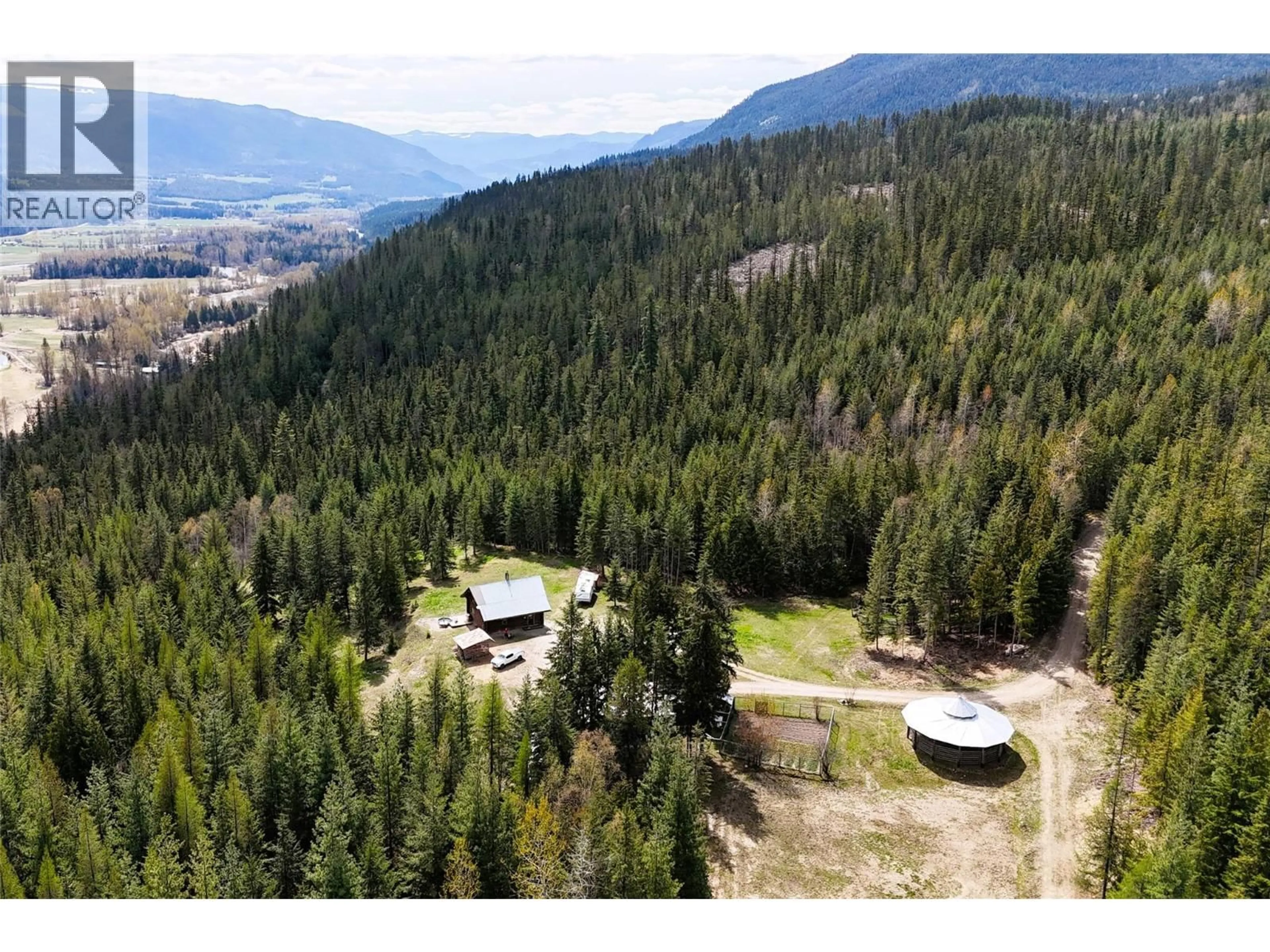 A pic from outside/outdoor area/front of a property/back of a property/a pic from drone, mountain view for 1425 BOBBIE BURNS ROAD, Lumby British Columbia V0E2C4