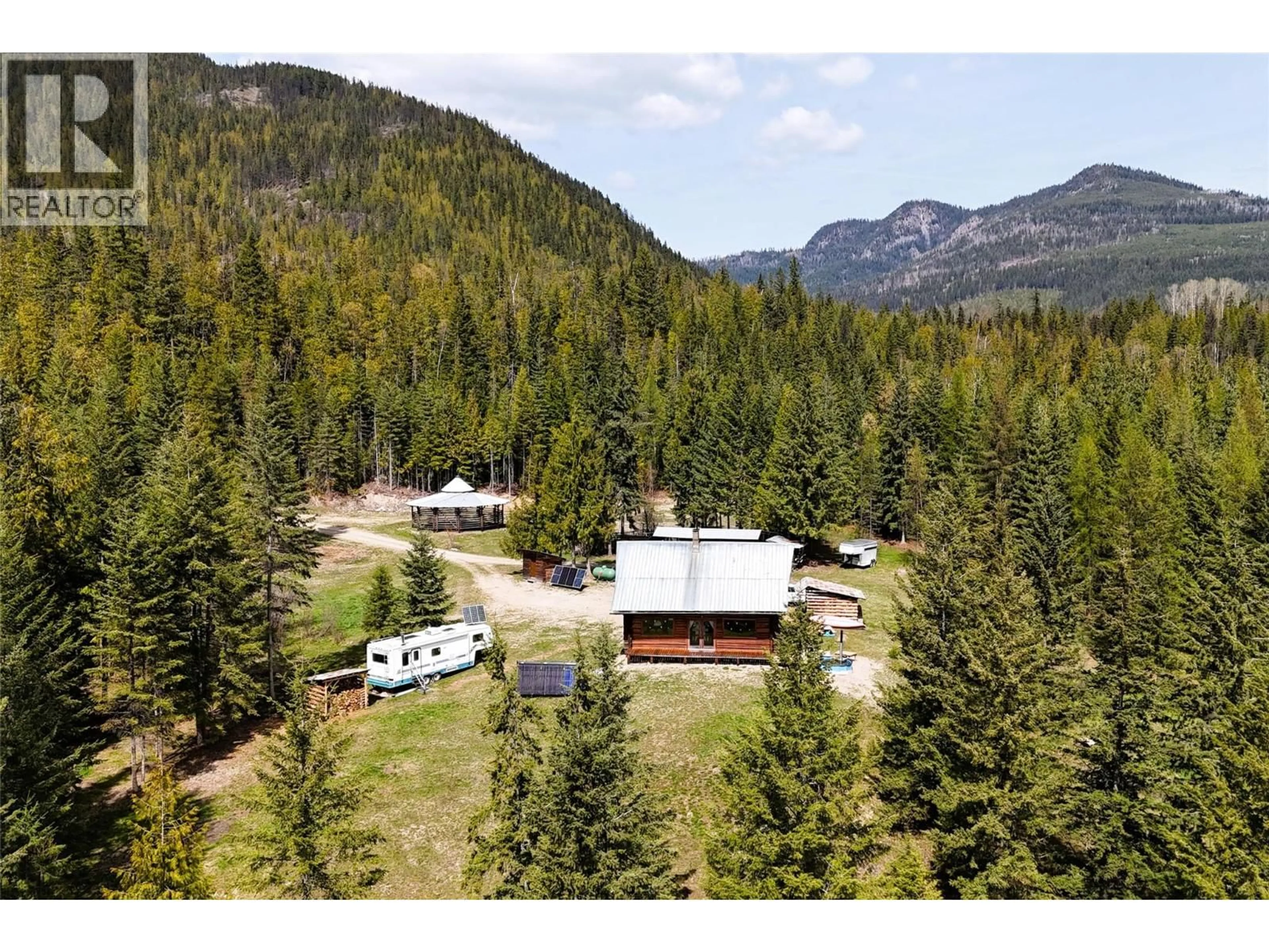 A pic from outside/outdoor area/front of a property/back of a property/a pic from drone, mountain view for 1425 BOBBIE BURNS ROAD, Lumby British Columbia V0E2C4