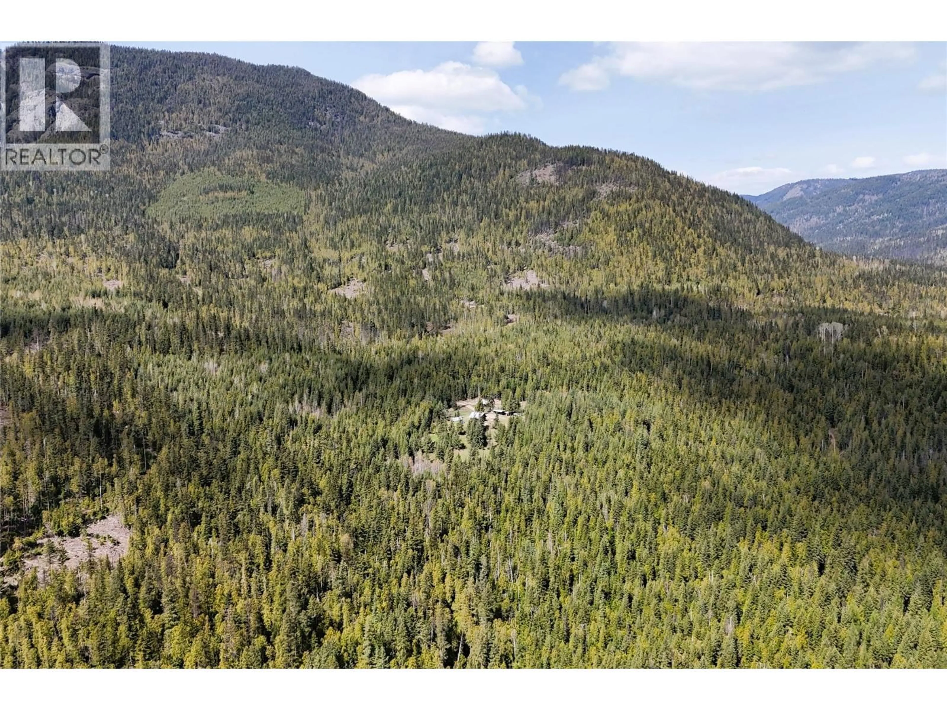 A pic from outside/outdoor area/front of a property/back of a property/a pic from drone, forest/trees view for 1425 BOBBIE BURNS ROAD, Lumby British Columbia V0E2C4