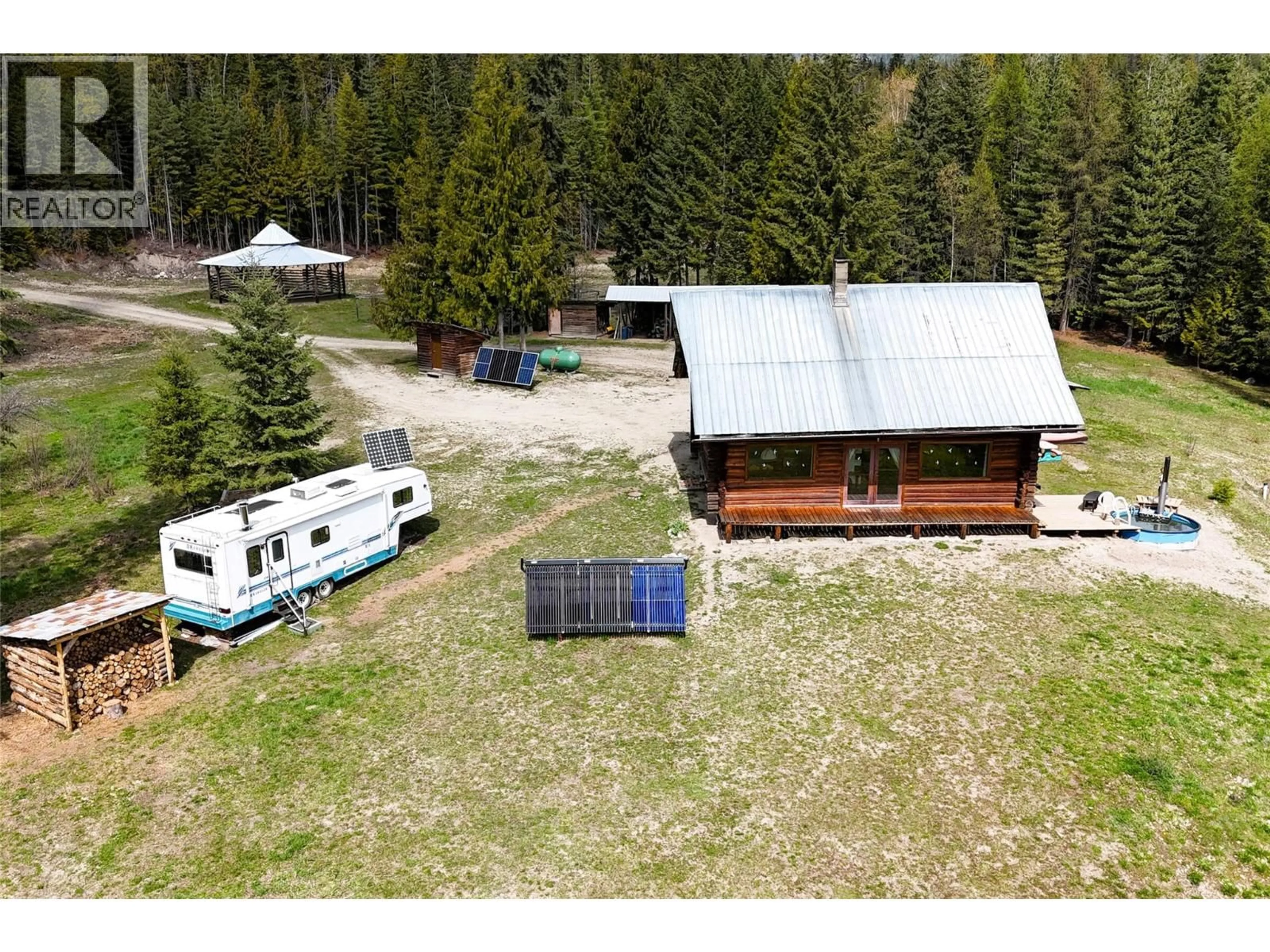 A pic from outside/outdoor area/front of a property/back of a property/a pic from drone, unknown for 1425 BOBBIE BURNS ROAD, Lumby British Columbia V0E2C4