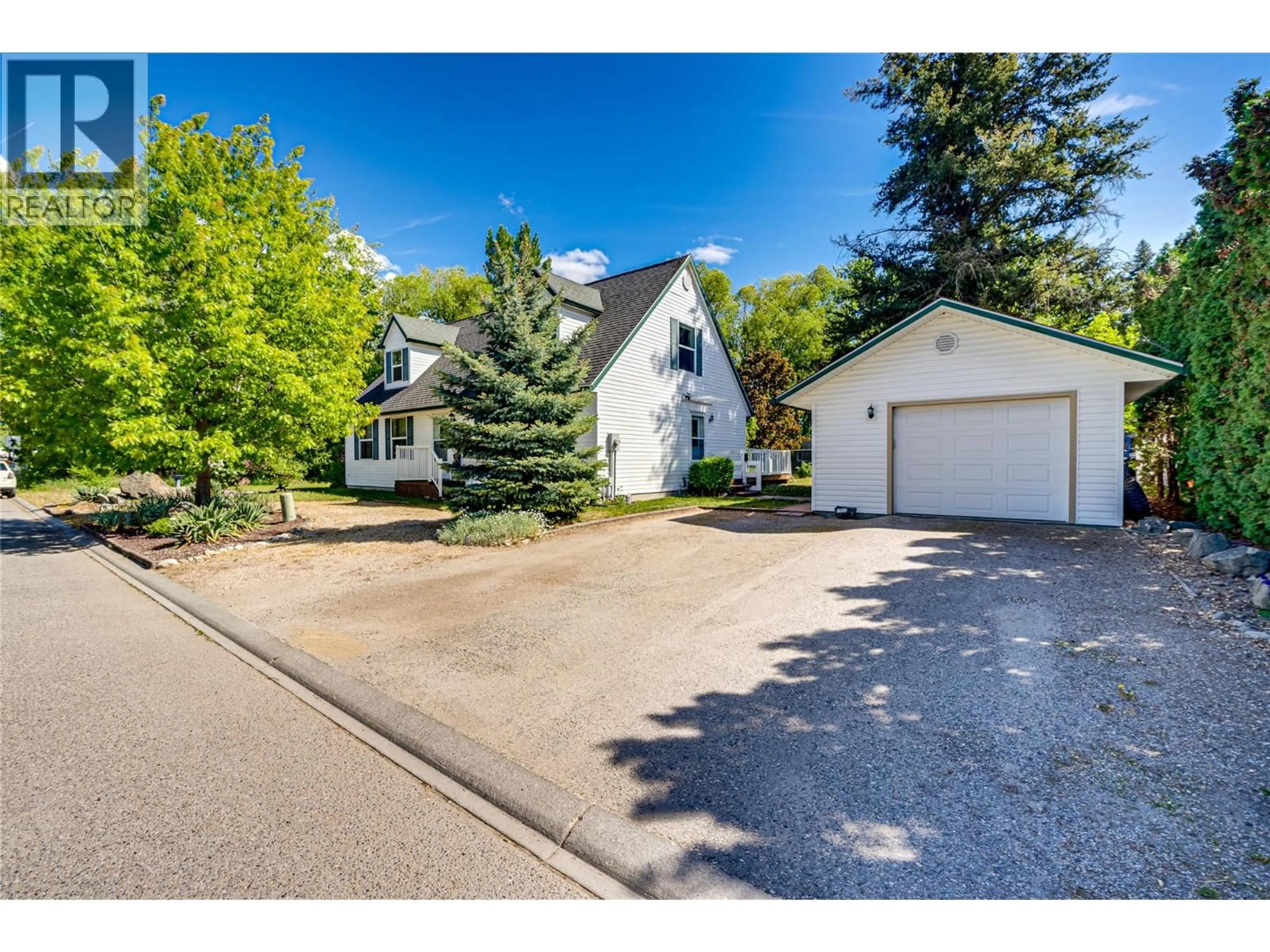A pic from outside/outdoor area/front of a property/back of a property/a pic from drone, street for 1902 50 AVENUE, Vernon British Columbia V1T4E8
