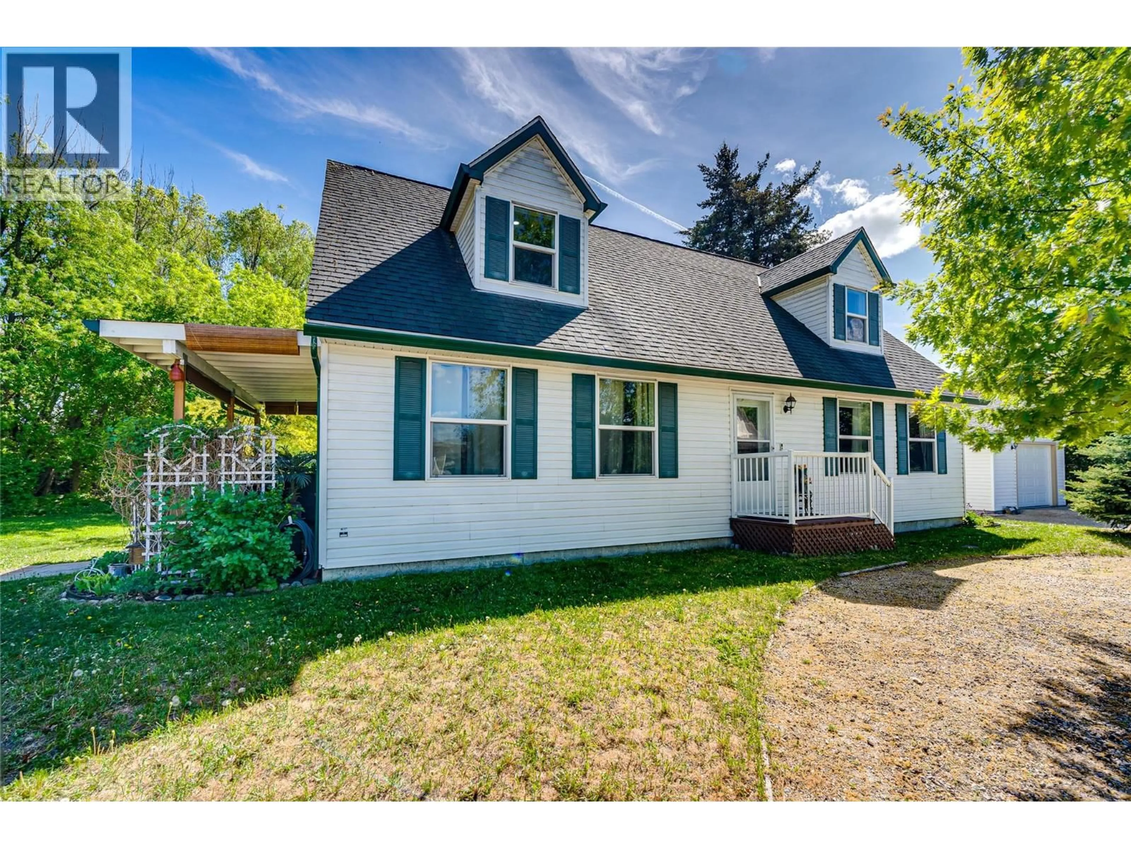 Home with vinyl exterior material, street for 1902 50 AVENUE, Vernon British Columbia V1T4E8