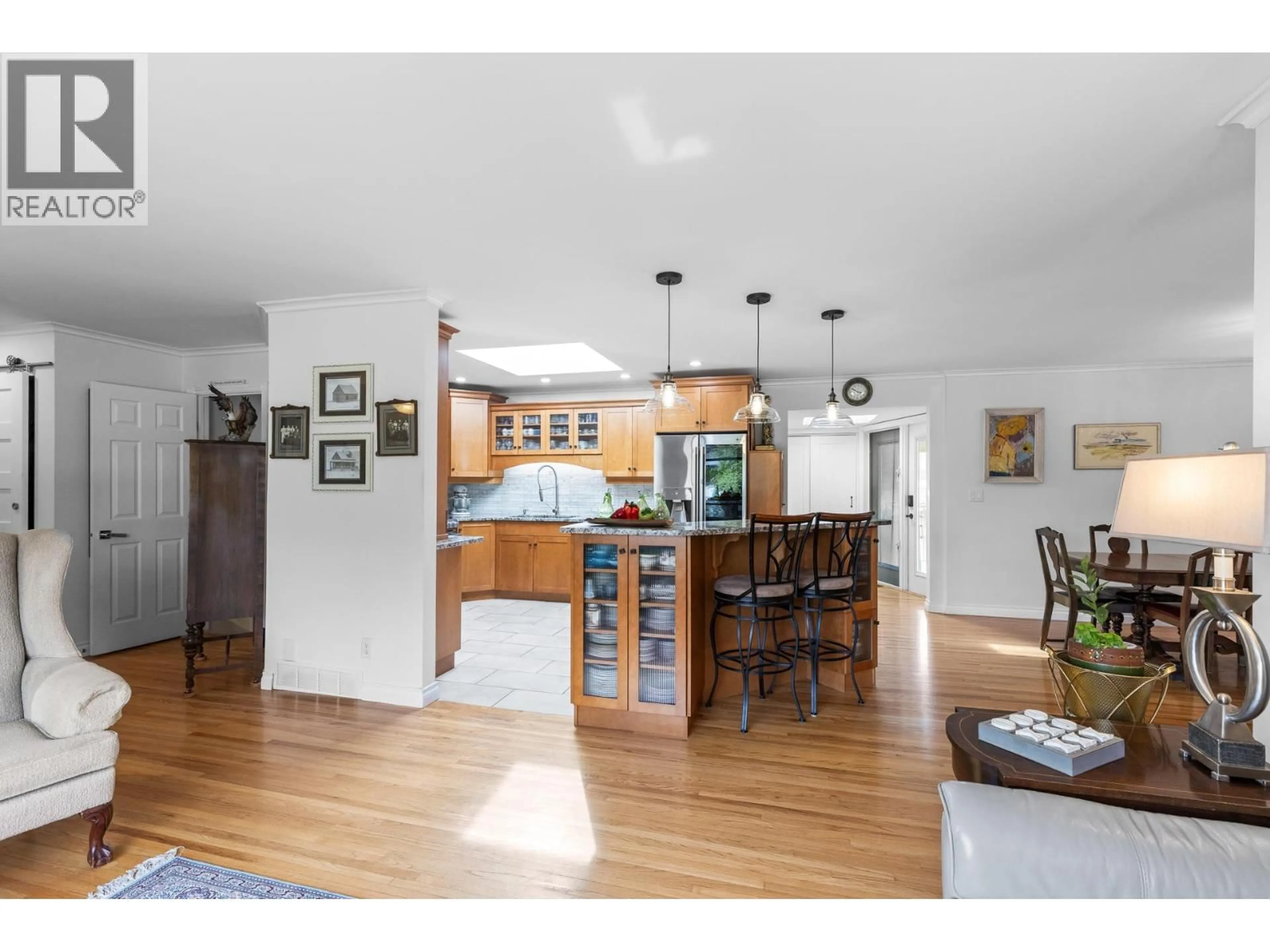Open concept kitchen, wood/laminate floor for 740 ACE ROAD, Kelowna British Columbia V1X4C5
