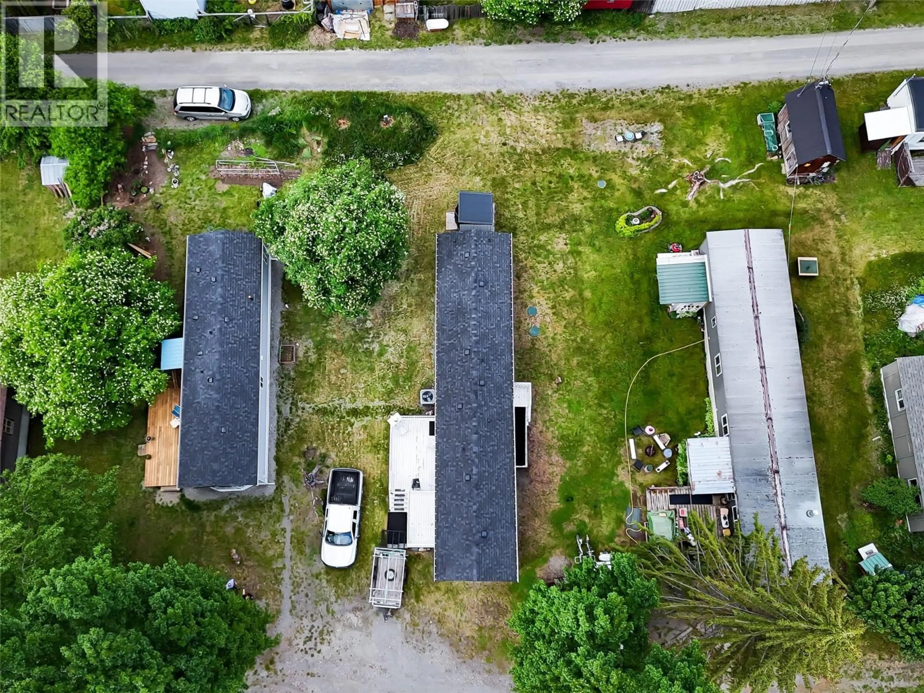 A pic from outside/outdoor area/front of a property/back of a property/a pic from drone, street for 3 - 244 E AVENUE, Kaslo British Columbia V0G1M0