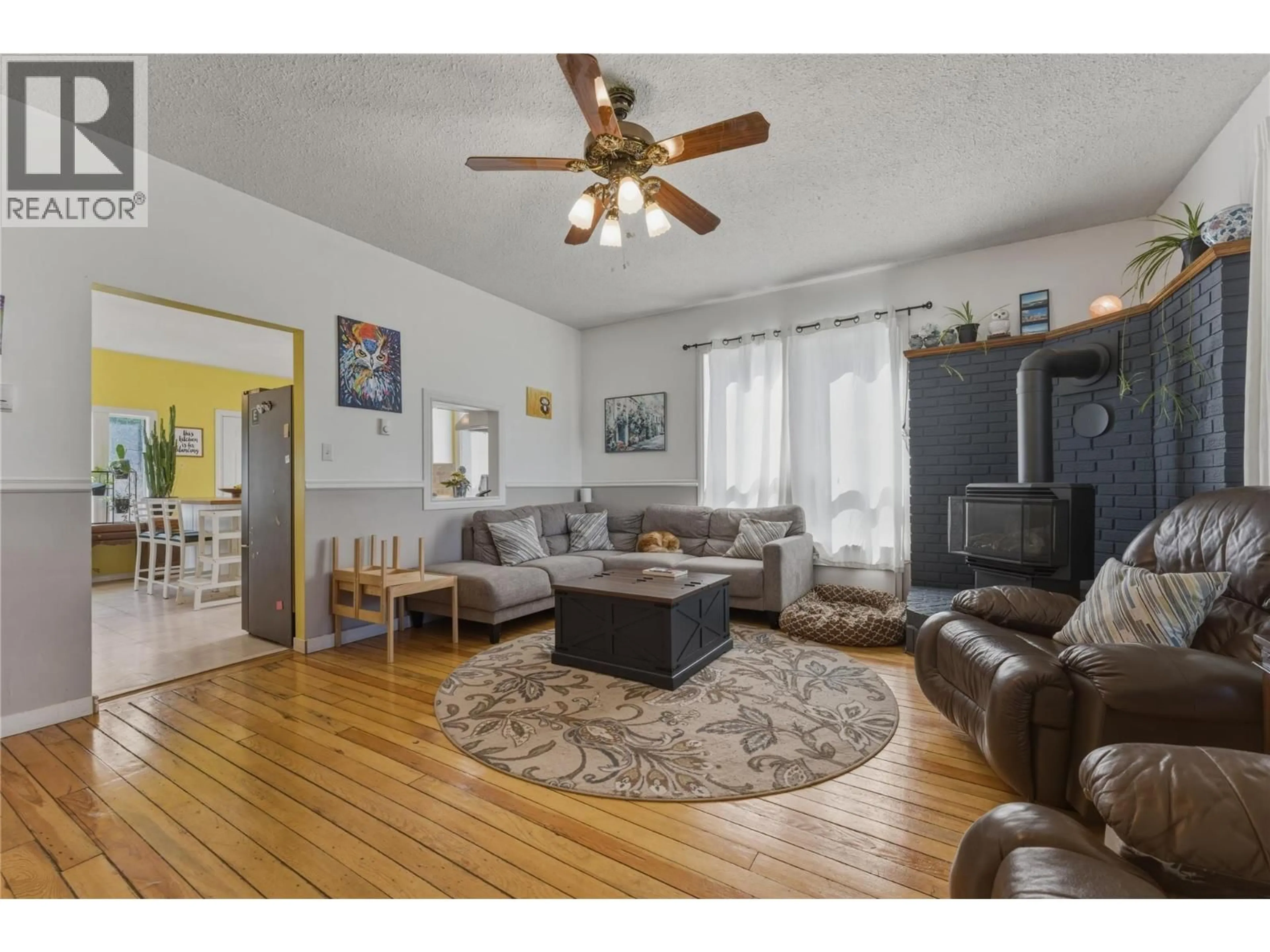 Living room with furniture, wood/laminate floor for 2355 ROSEDALE AVENUE, Armstrong British Columbia V4Y0B5