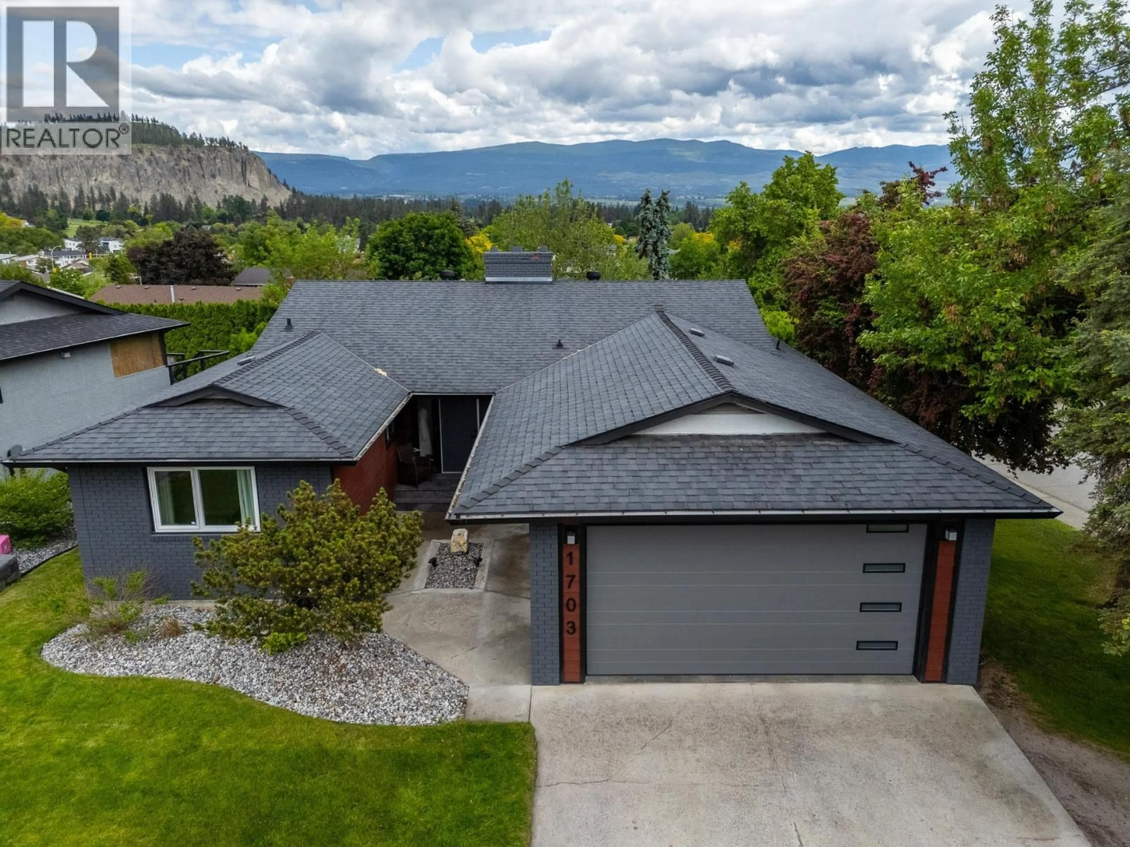 A pic from outside/outdoor area/front of a property/back of a property/a pic from drone, mountain view for 1703 SONORA DRIVE, Kelowna British Columbia V1Y8G2