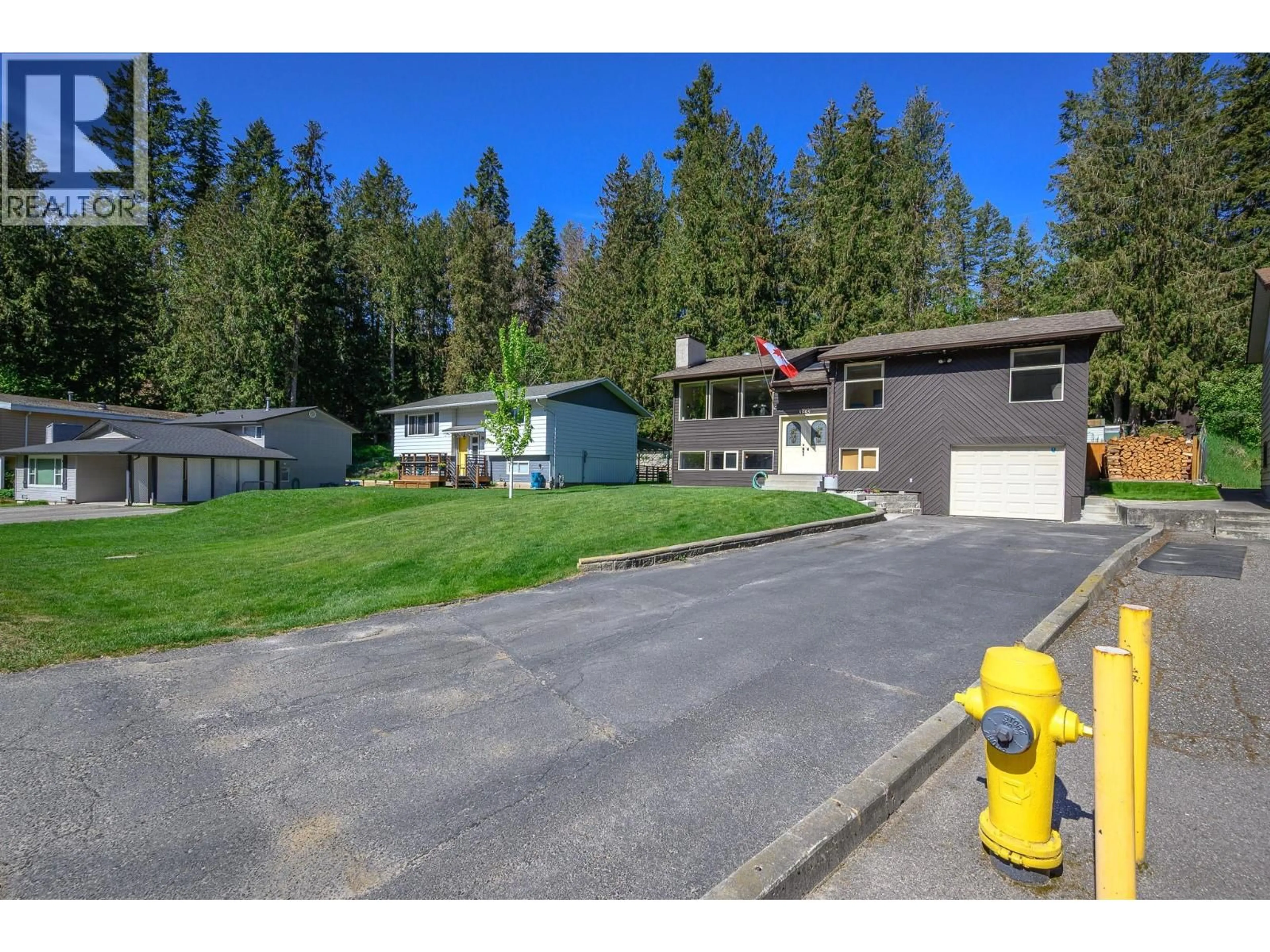 A pic from outside/outdoor area/front of a property/back of a property/a pic from drone, street for 3895 HIGHLAND PARK DRIVE, Armstrong British Columbia V4Y0K2