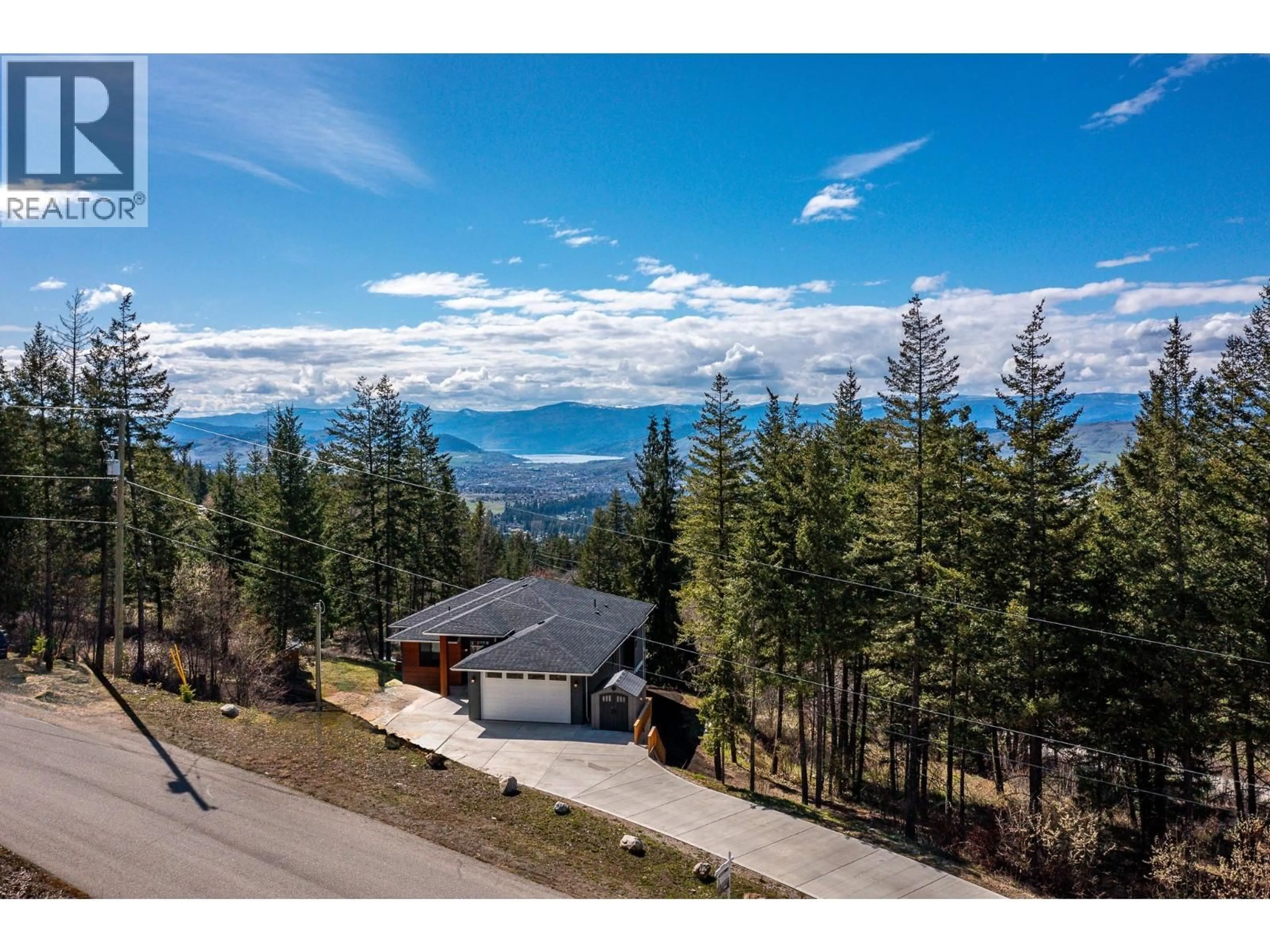 A pic from outside/outdoor area/front of a property/back of a property/a pic from drone, mountain view for 5720 HARTNELL ROAD, Vernon British Columbia V1B3J5