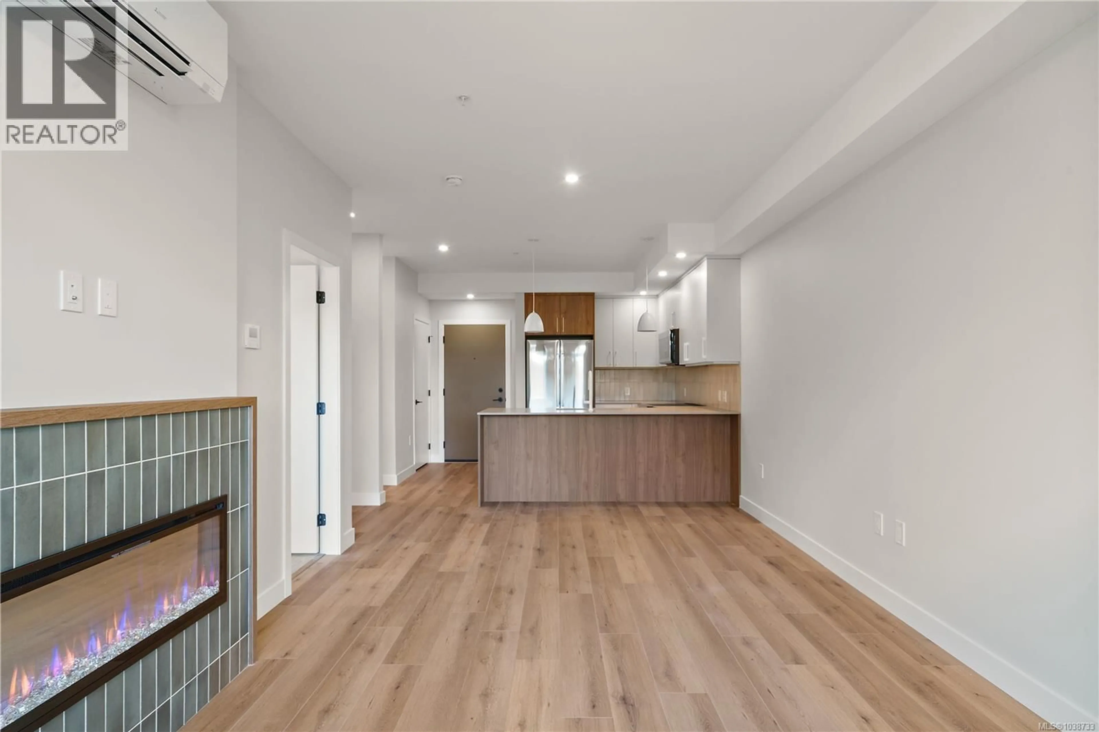 Open concept kitchen, wood/laminate floor for 213 - 2881 LEIGH ROAD, Langford British Columbia V9B4G5