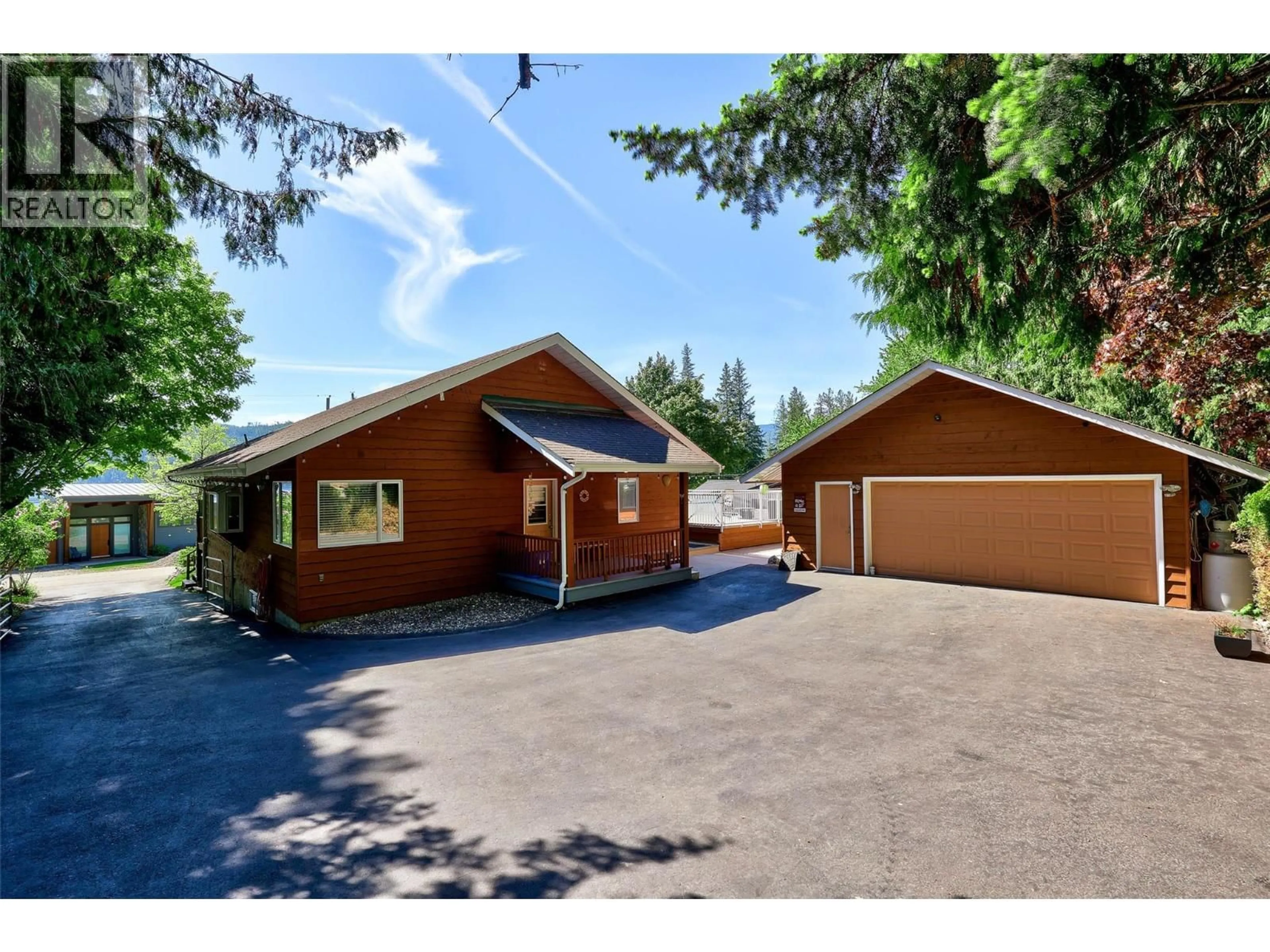 A pic from outside/outdoor area/front of a property/back of a property/a pic from drone, street for 8697 ST. IVES ROAD, St. Ives British Columbia V0E1M9