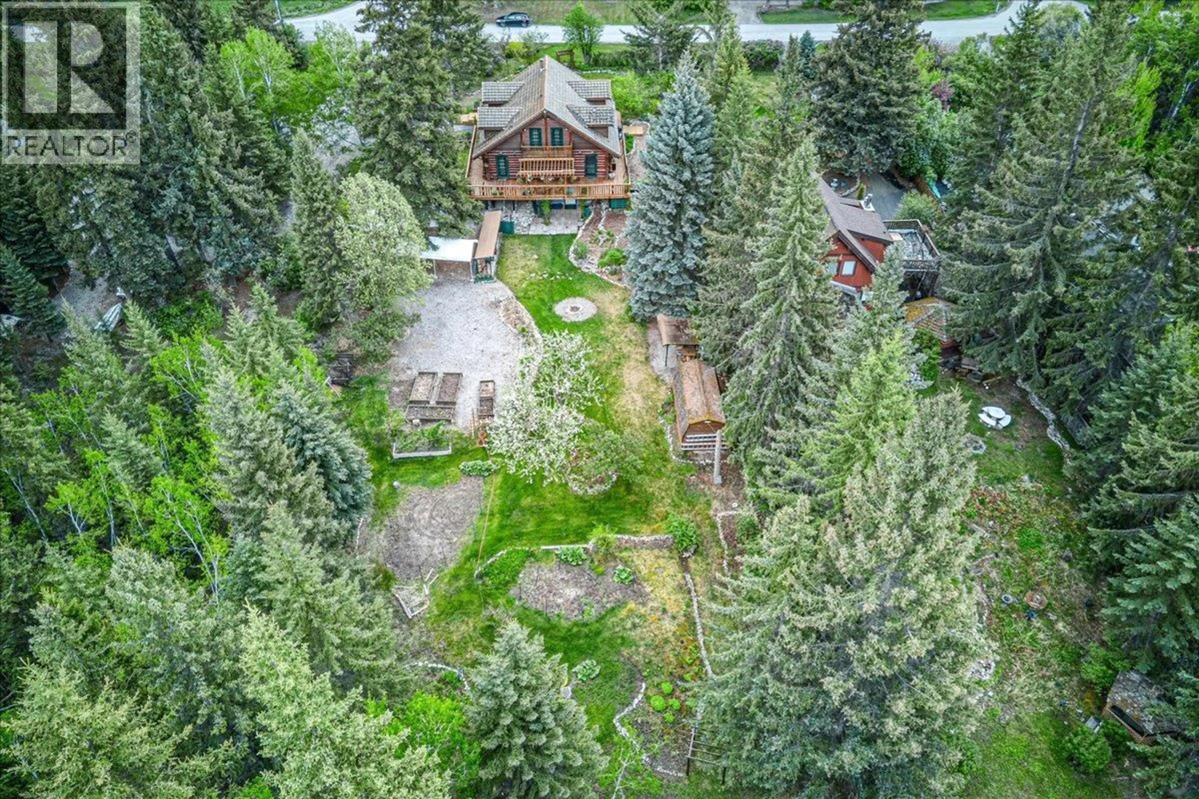 A pic from outside/outdoor area/front of a property/back of a property/a pic from drone, forest/trees view for 4985 OGILVEY AVENUE, Fairmont Hot Springs British Columbia V0B1L1