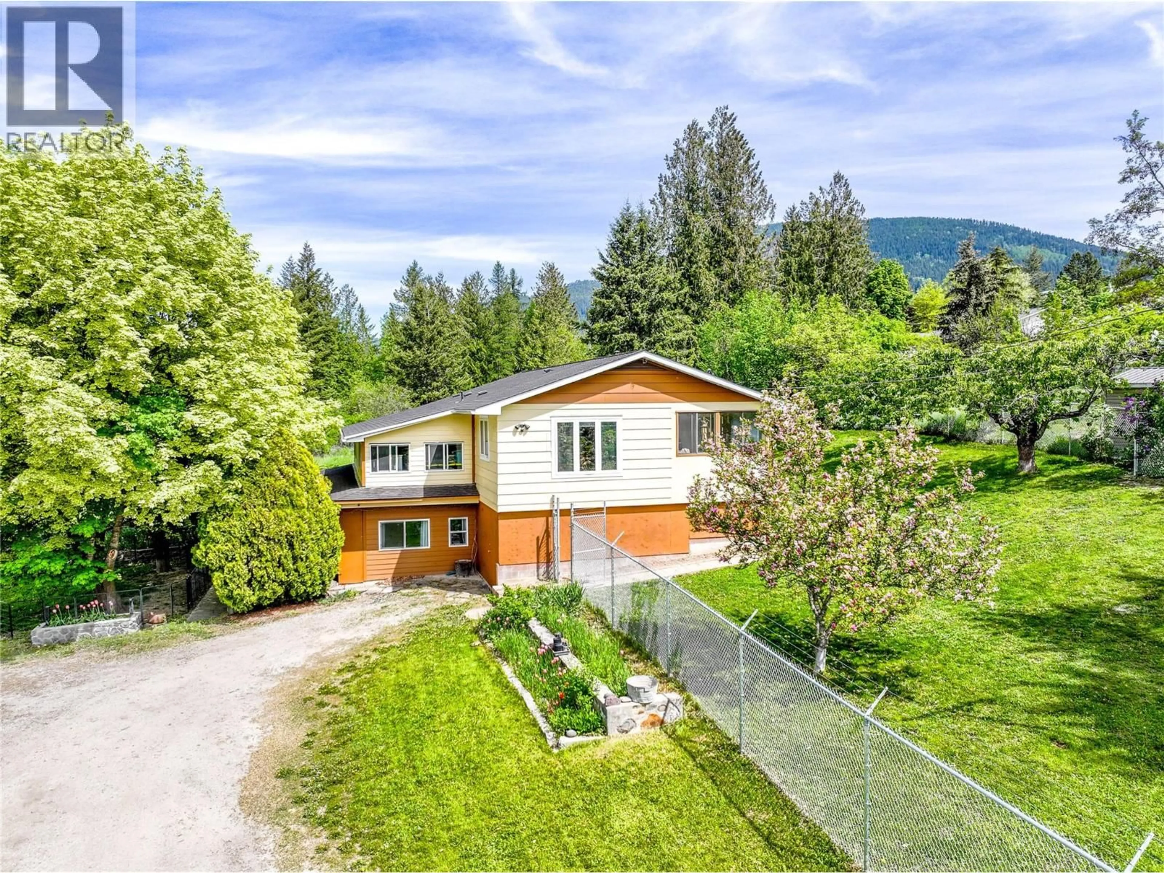 A pic from outside/outdoor area/front of a property/back of a property/a pic from drone, mountain view for 510 ERICKSON ROAD, Creston British Columbia V0B1G3