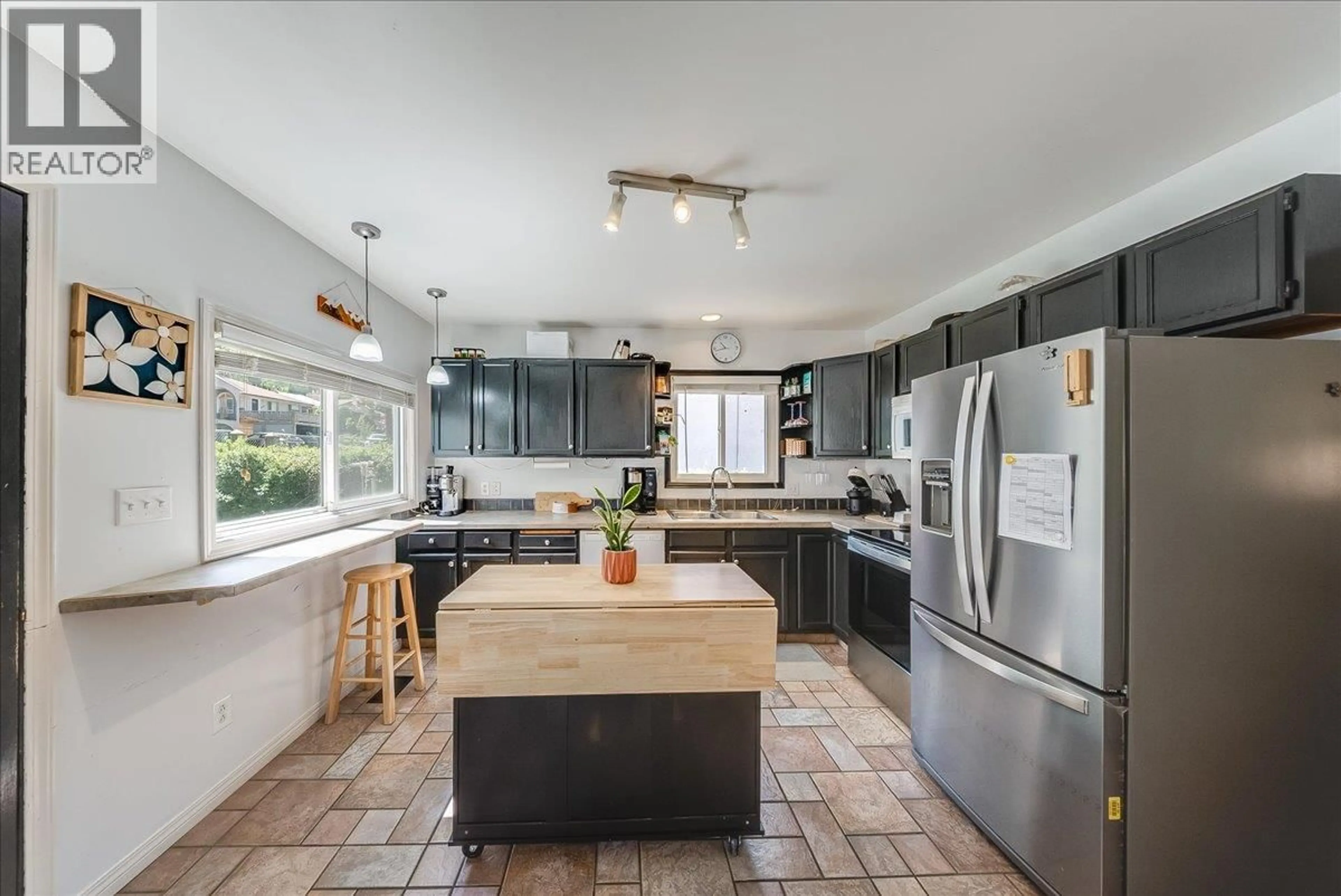 Open concept kitchen, ceramic/tile floor for 128 HAIG STREET, Warfield British Columbia V1R2L9