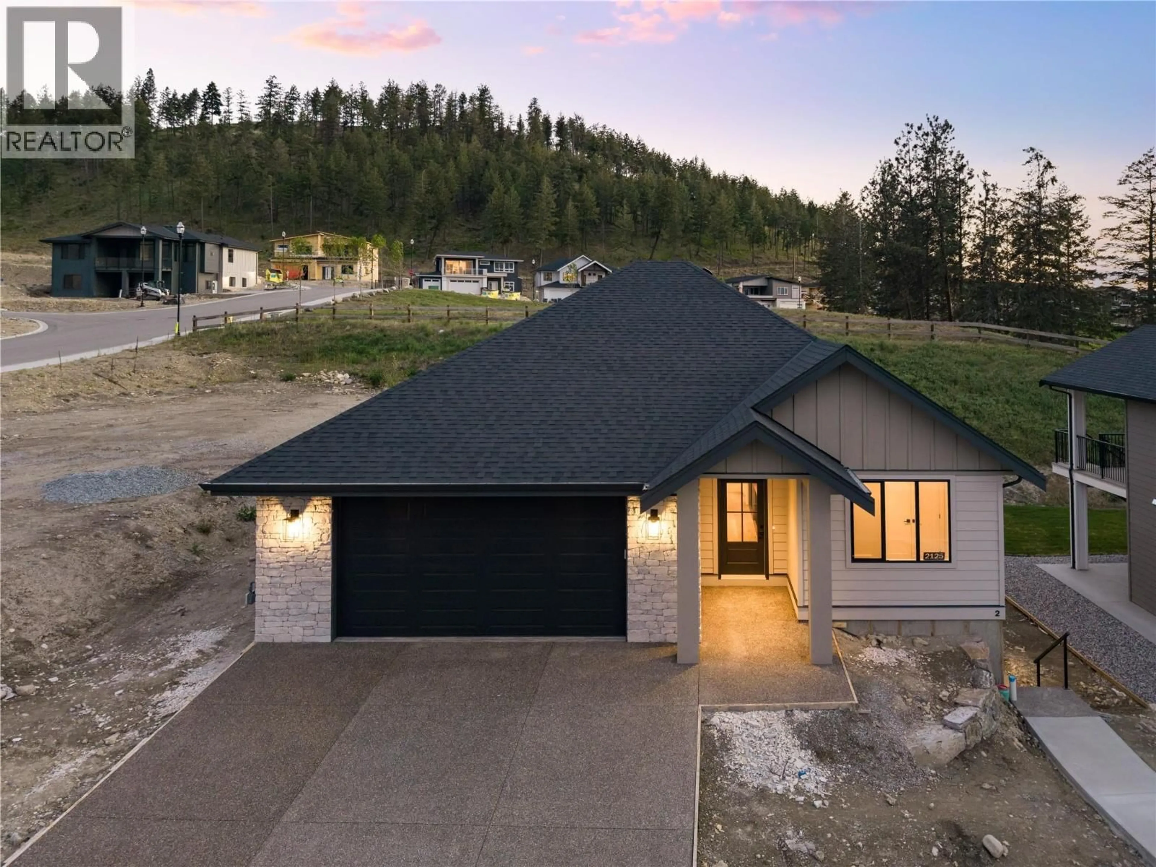 A pic from outside/outdoor area/front of a property/back of a property/a pic from drone, street for 2125 MONTENEGRO DRIVE, Kelowna British Columbia V1P0B2