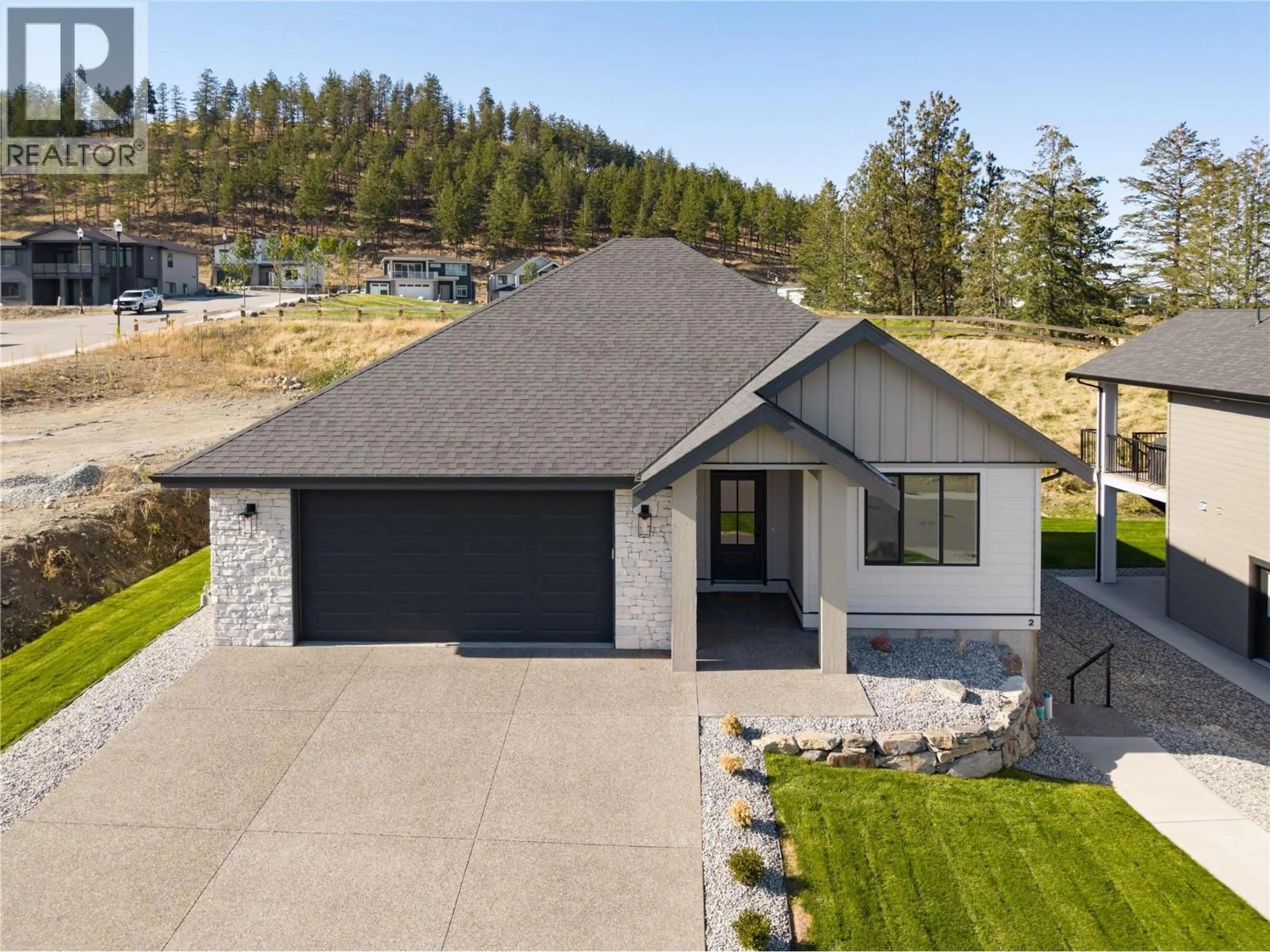 A pic from outside/outdoor area/front of a property/back of a property/a pic from drone, street for 2125 MONTENEGRO DRIVE, Kelowna British Columbia V1P0B2