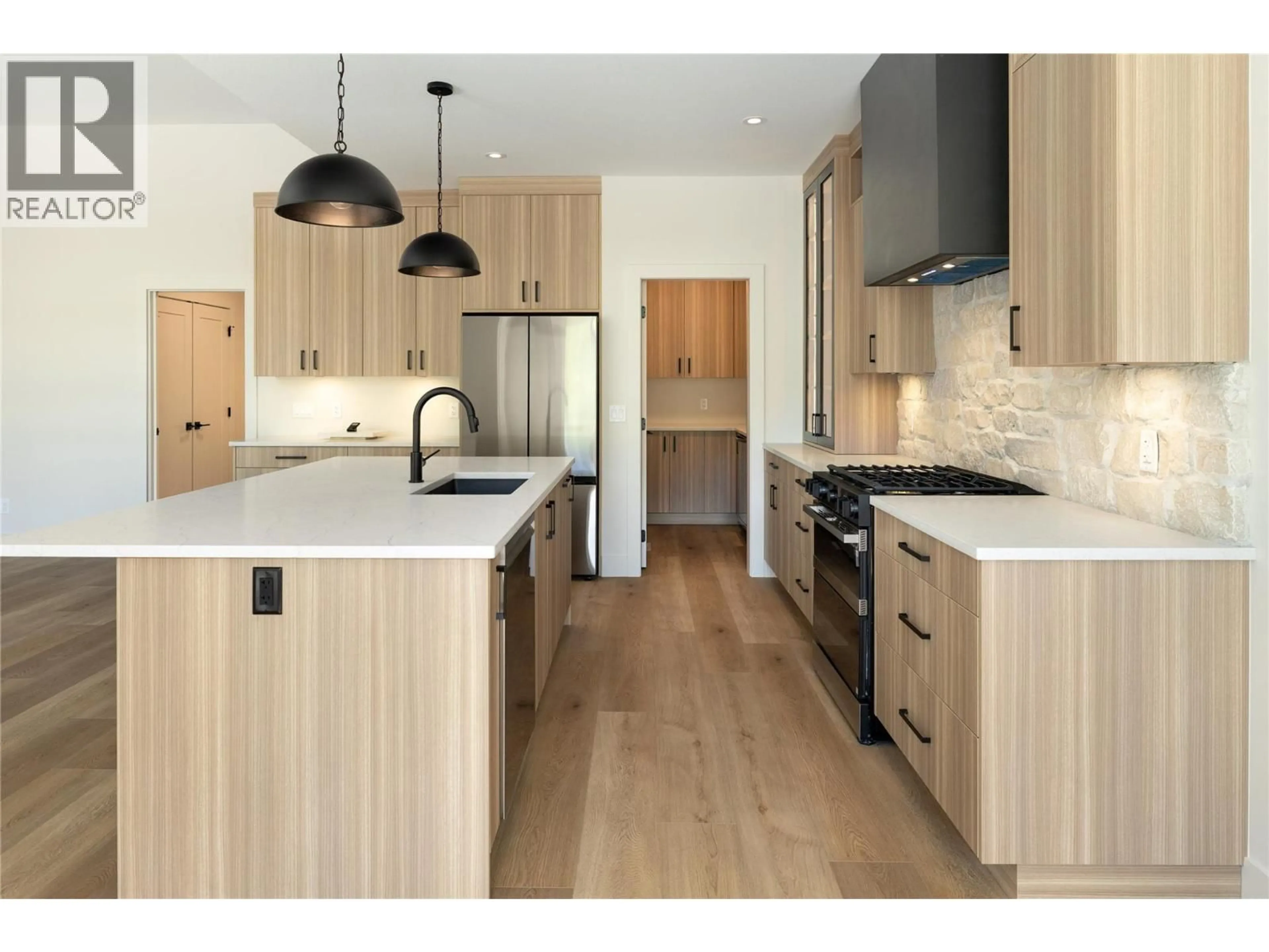 Contemporary kitchen, wood/laminate floor for 2125 MONTENEGRO DRIVE, Kelowna British Columbia V1P0B2