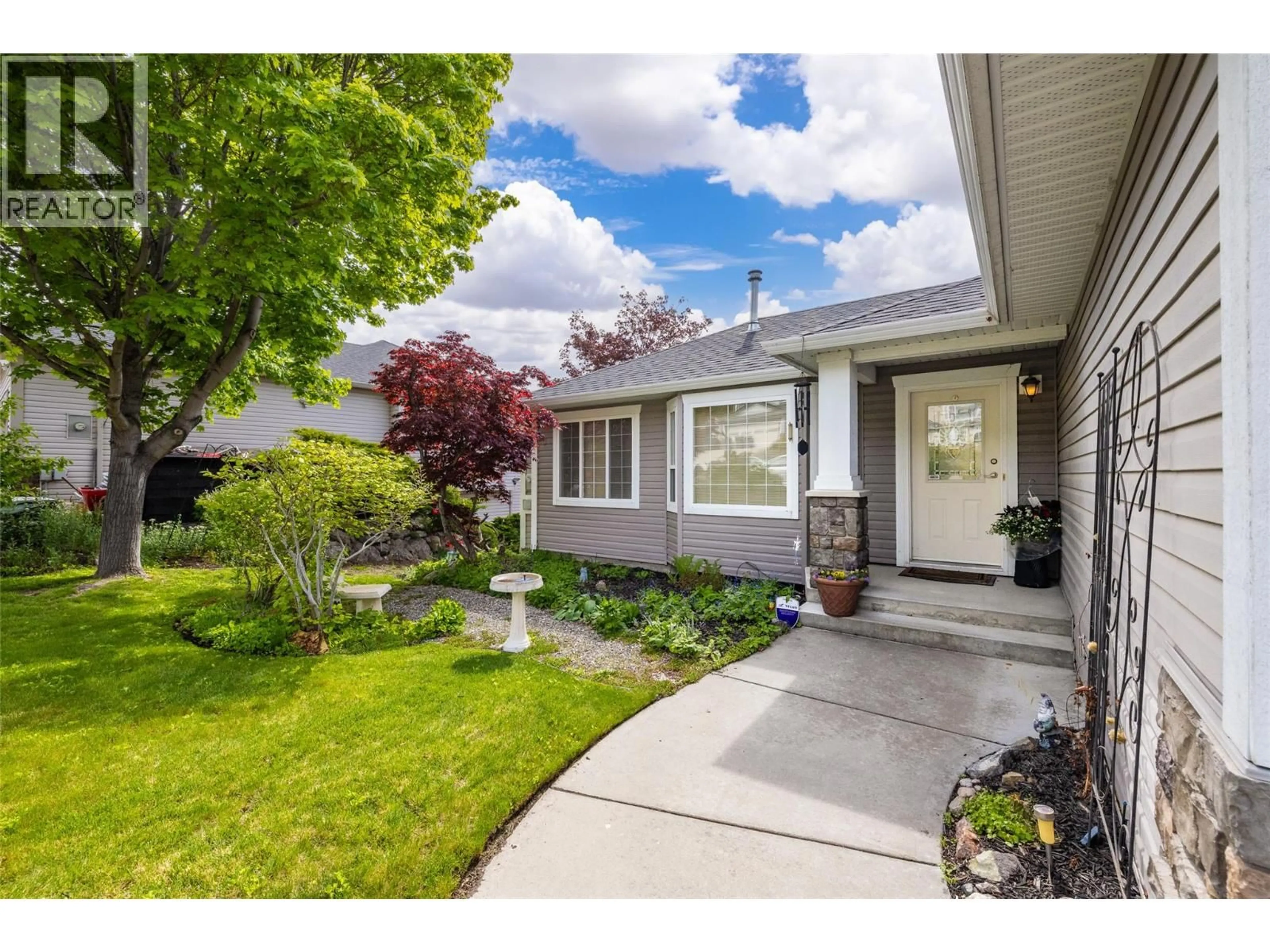 Home with vinyl exterior material, street for 1999 ROSEALEE LANE, West Kelowna British Columbia V1Z3Z6