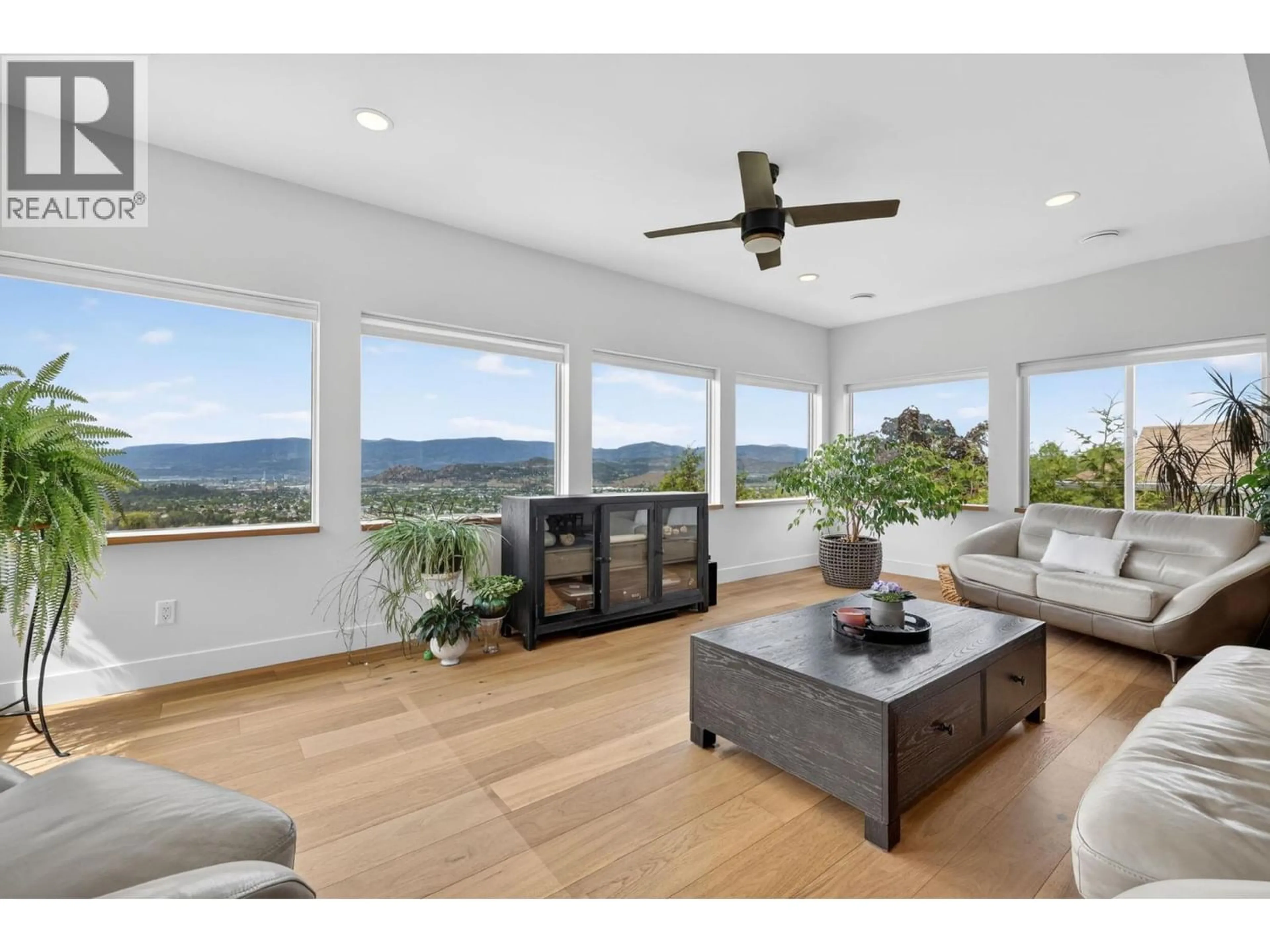 Living room with furniture, wood/laminate floor for 823 ACKERMAN COURT, Kelowna British Columbia V1X7L2