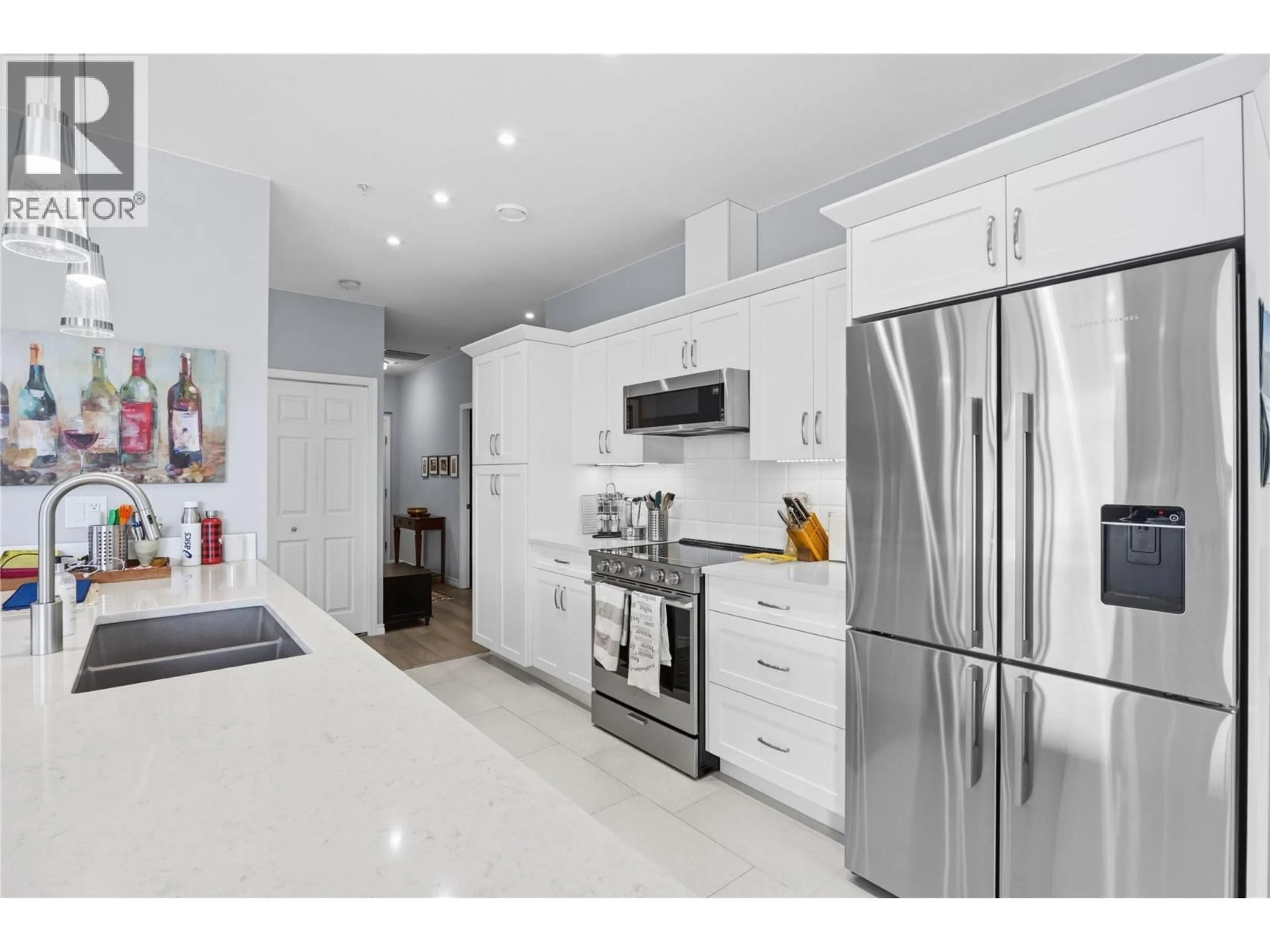 Open concept kitchen, ceramic/tile floor for 1104 - 3346 SKAHA LAKE ROAD, Penticton British Columbia V2A0H6