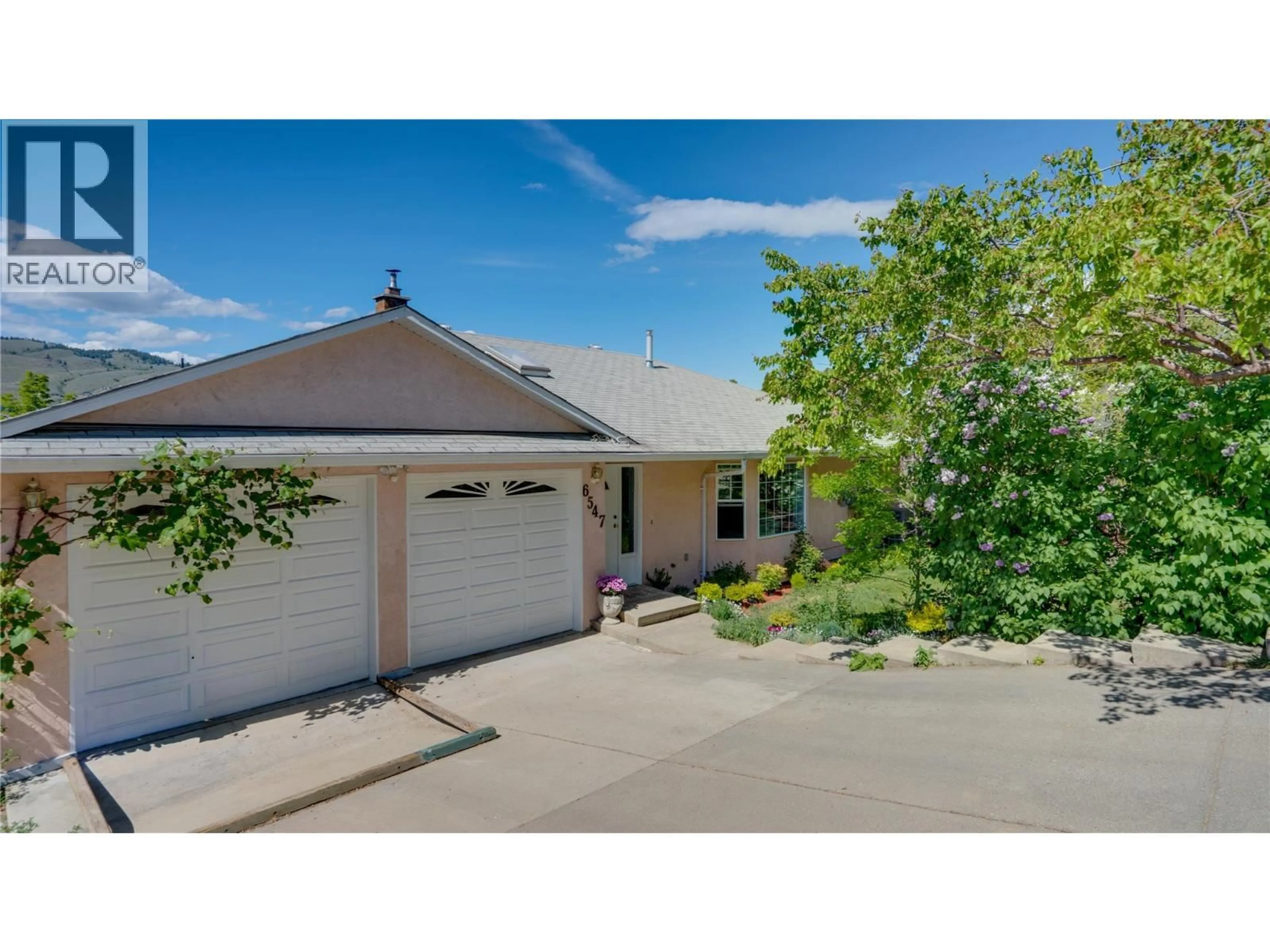 Home with vinyl exterior material, street for 6547 APOLLO ROAD, Vernon British Columbia V1H1J2