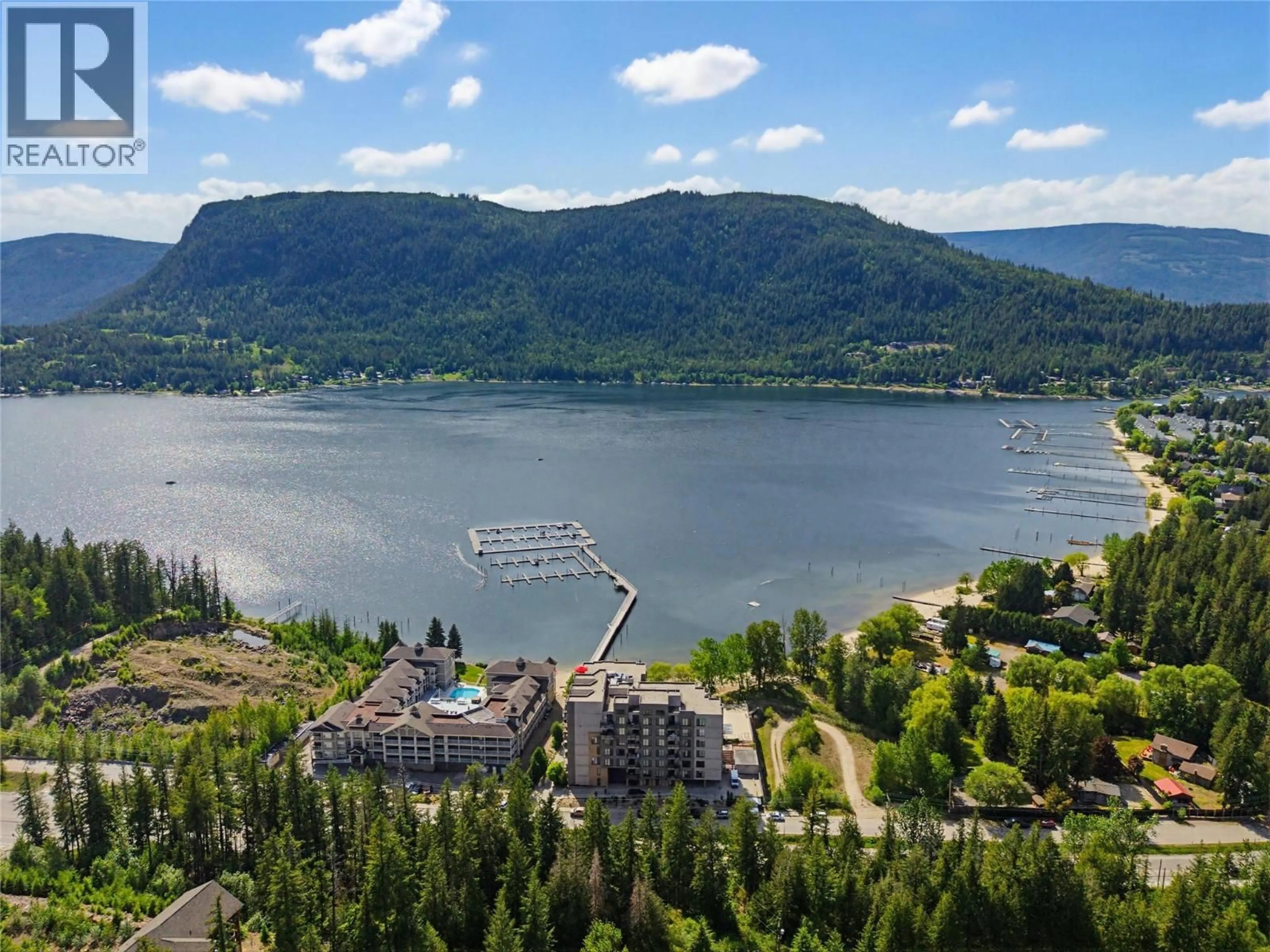 A pic from outside/outdoor area/front of a property/back of a property/a pic from drone, water/lake/river/ocean view for 404 - 326 MARA LAKE LANE, Sicamous British Columbia V0E2V1
