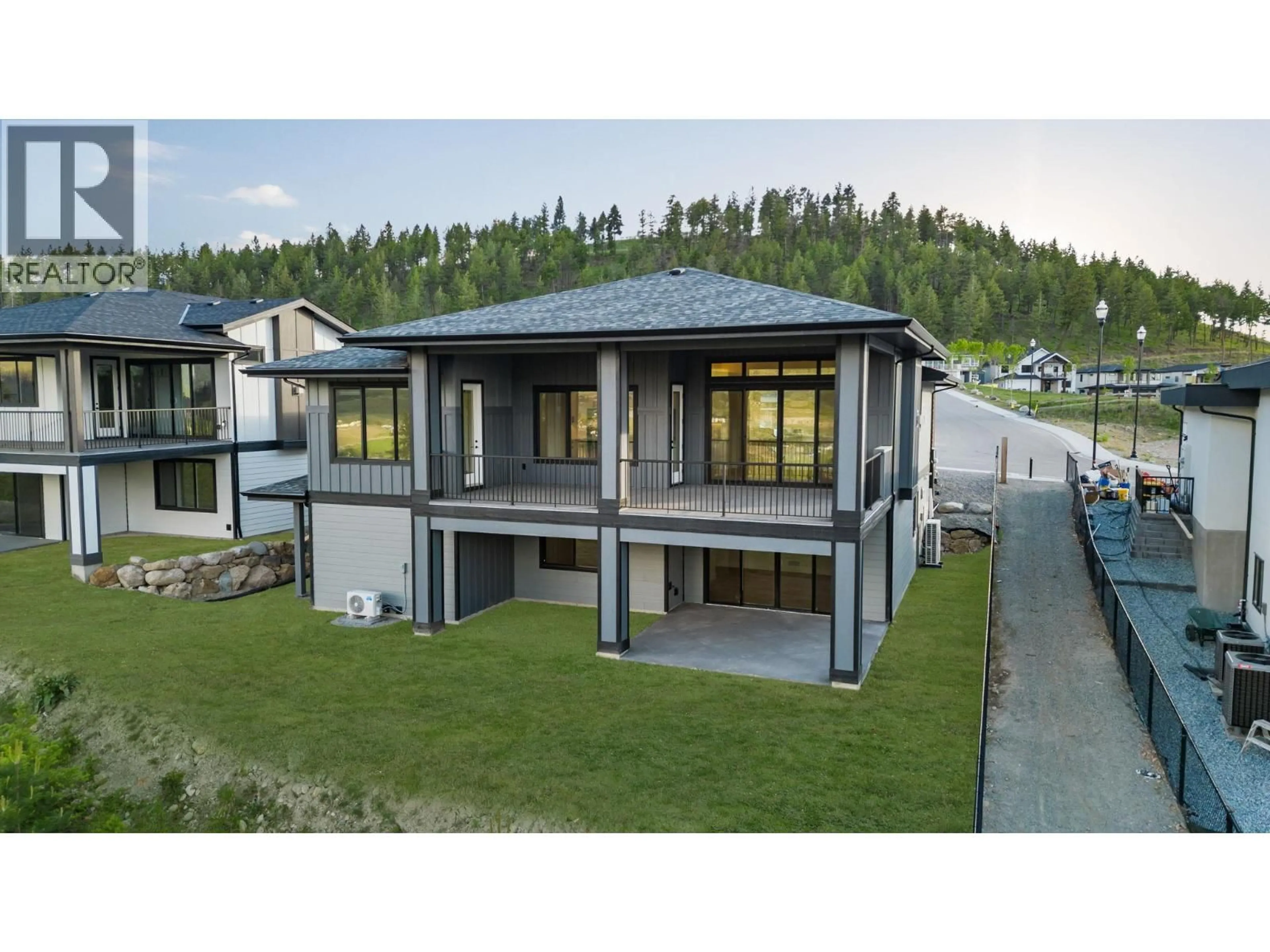 A pic from outside/outdoor area/front of a property/back of a property/a pic from drone, mountain view for 2140 MONTENEGRO DRIVE, Kelowna British Columbia V1P0B2