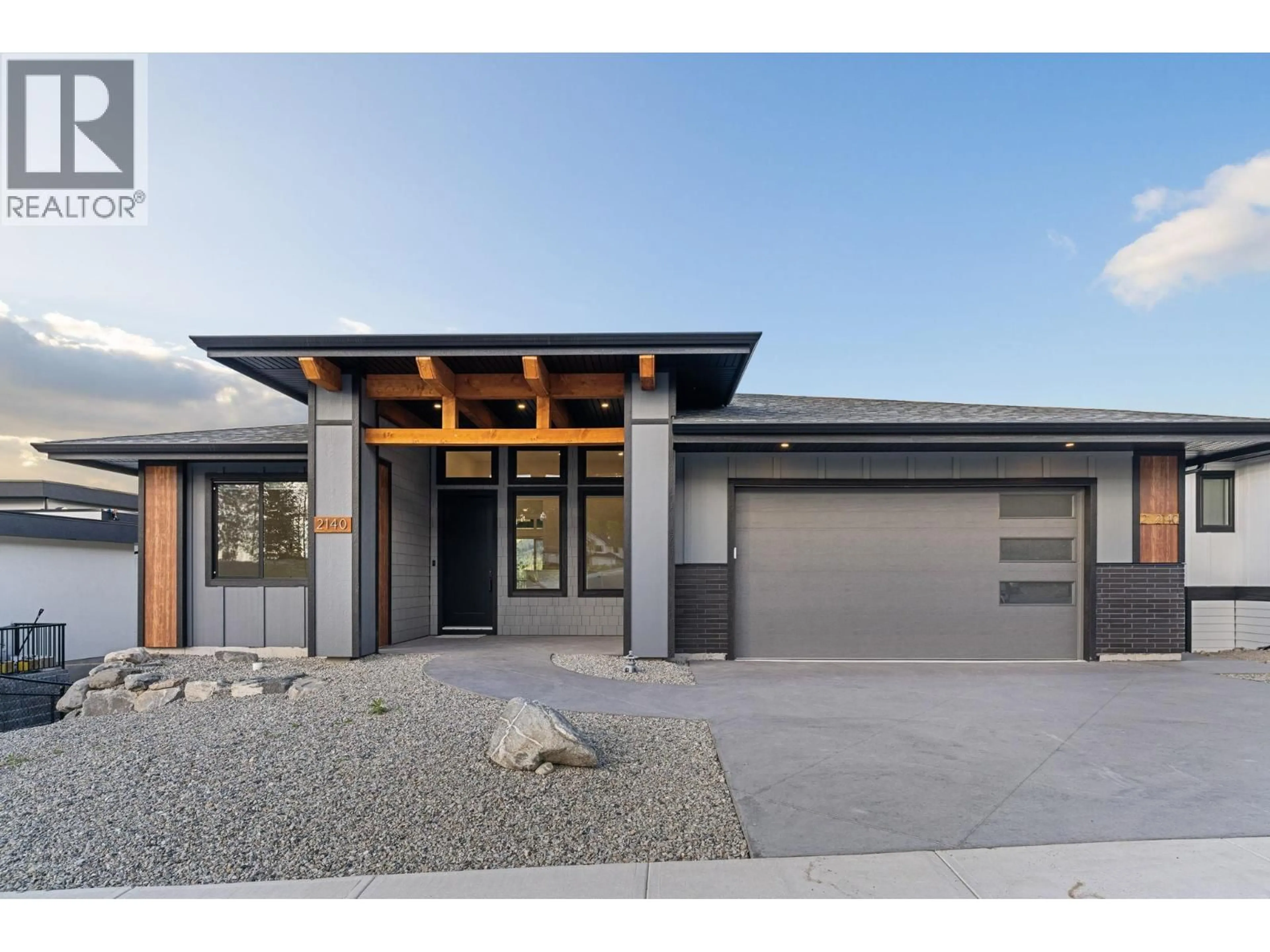 Home with brick exterior material, street for 2140 MONTENEGRO DRIVE, Kelowna British Columbia V1P0B2